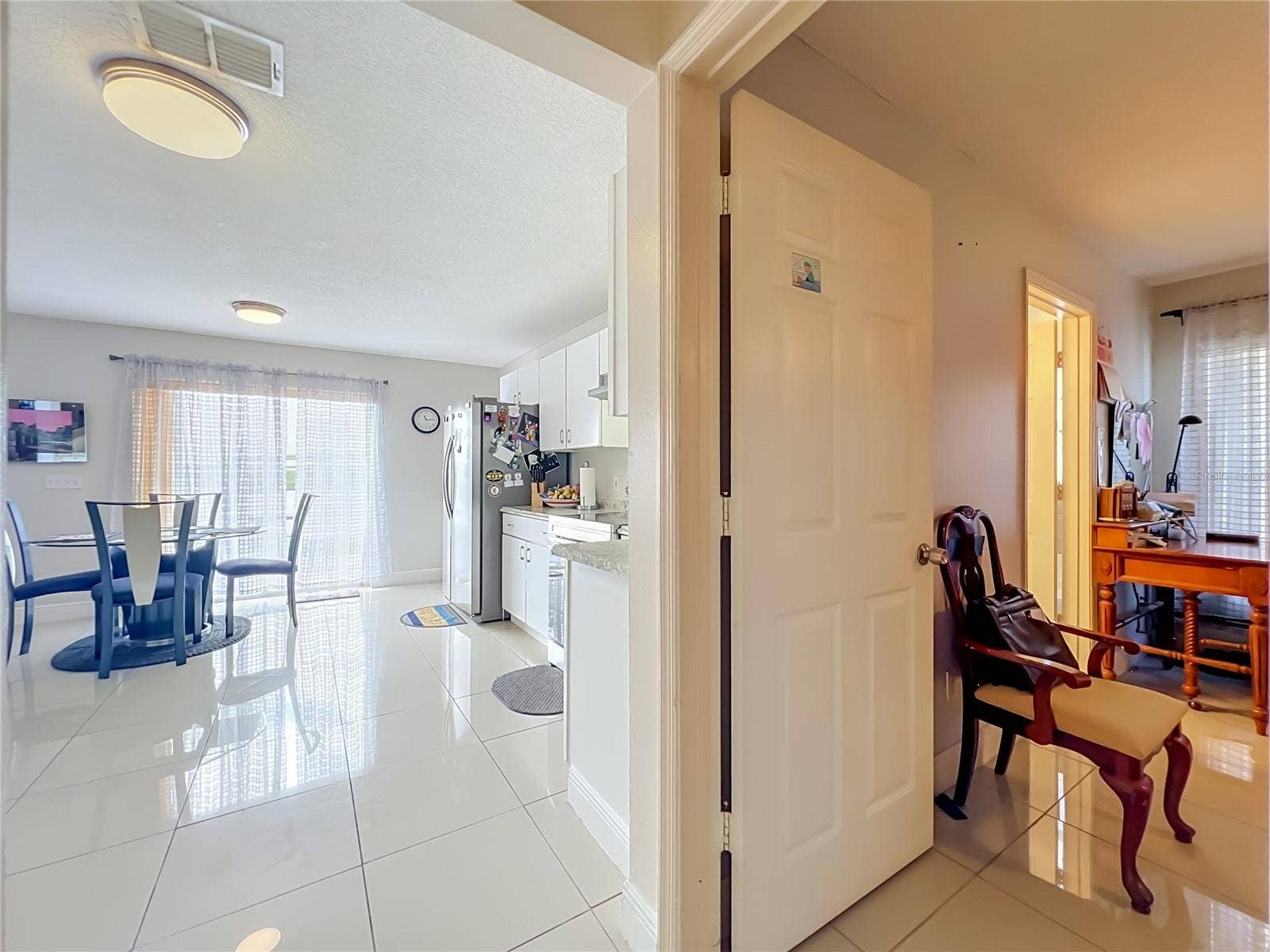 12900 LOS ALAMITOS COURT, Orlando, FL 32837 Dinette off kitchen is next to Primary bedroom on 1st floor
