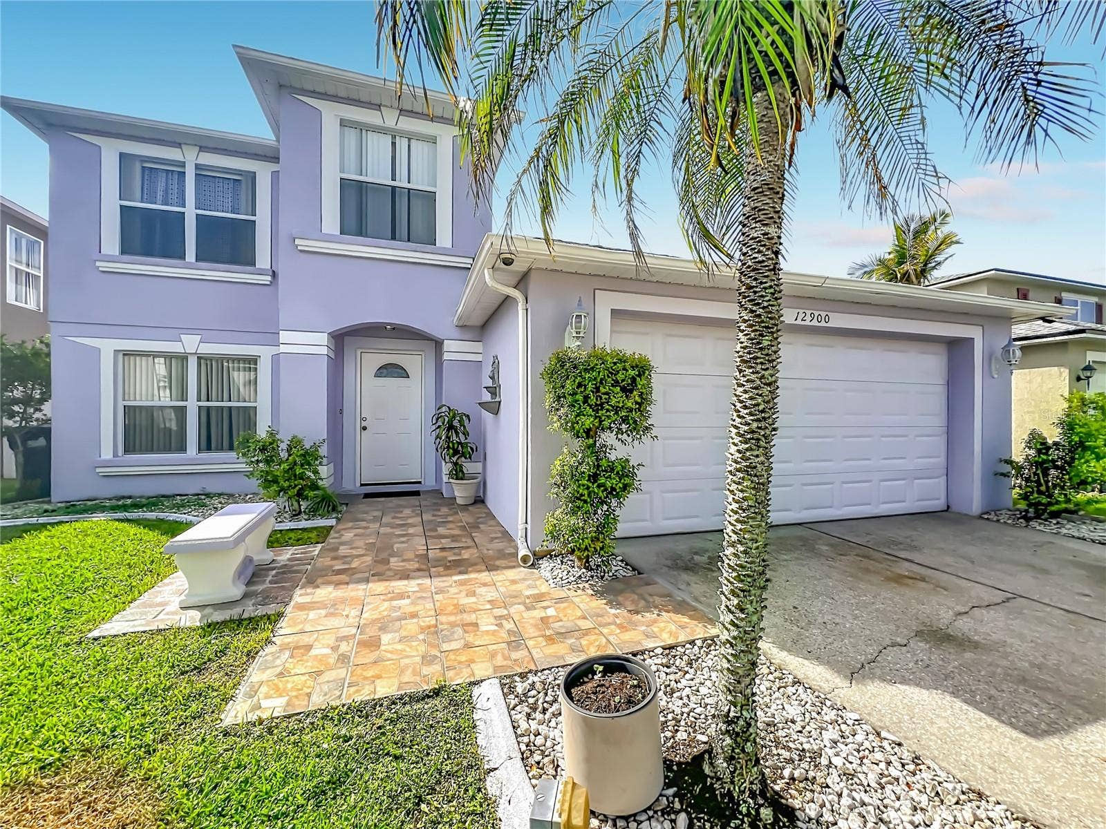 12900 LOS ALAMITOS COURT, Orlando, FL 32837 Tiled front entry with sitting bench