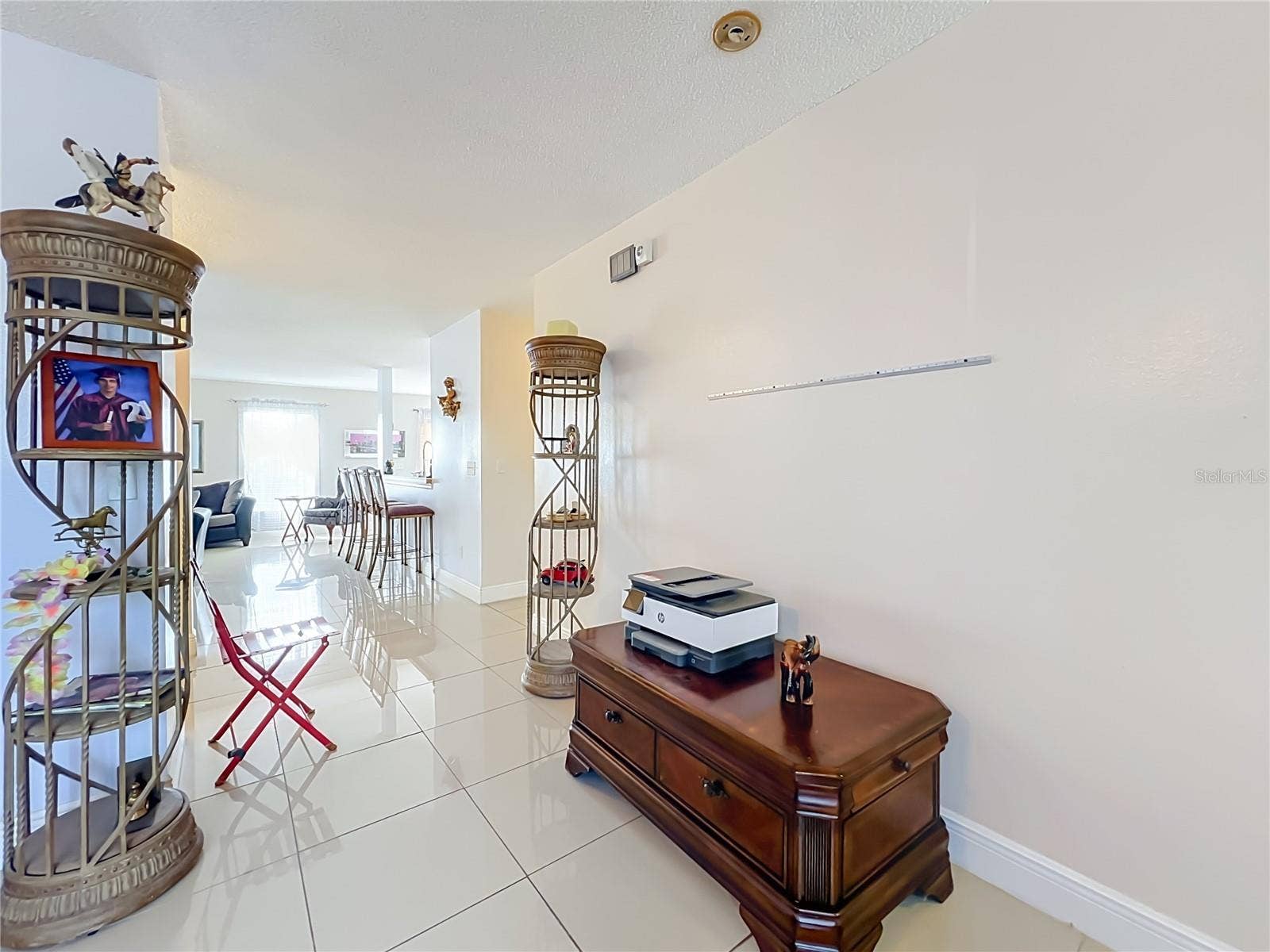 12900 LOS ALAMITOS COURT, Orlando, FL 32837 Looking from Living room into the family/kitchen area
