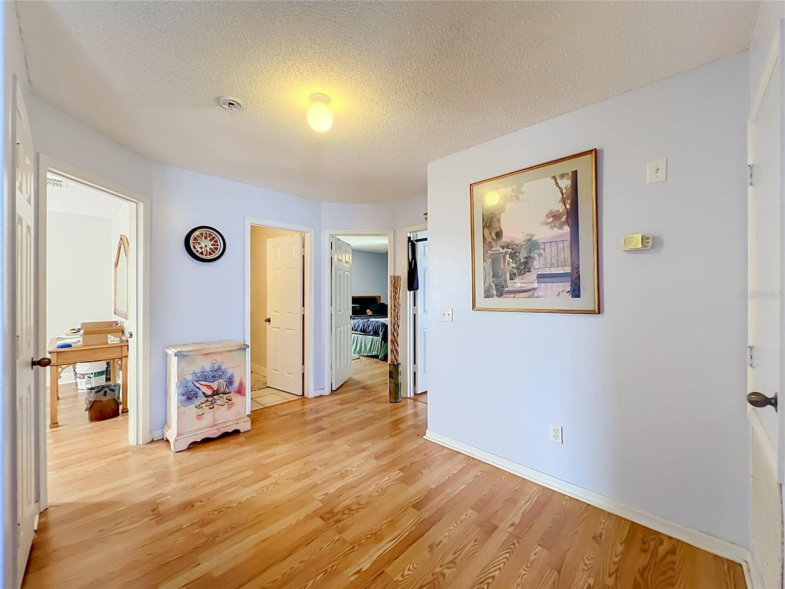 12900 LOS ALAMITOS COURT, Orlando, FL 32837 Beautiful wood laminate floors lead to 3 bedrooms on 2nd floor