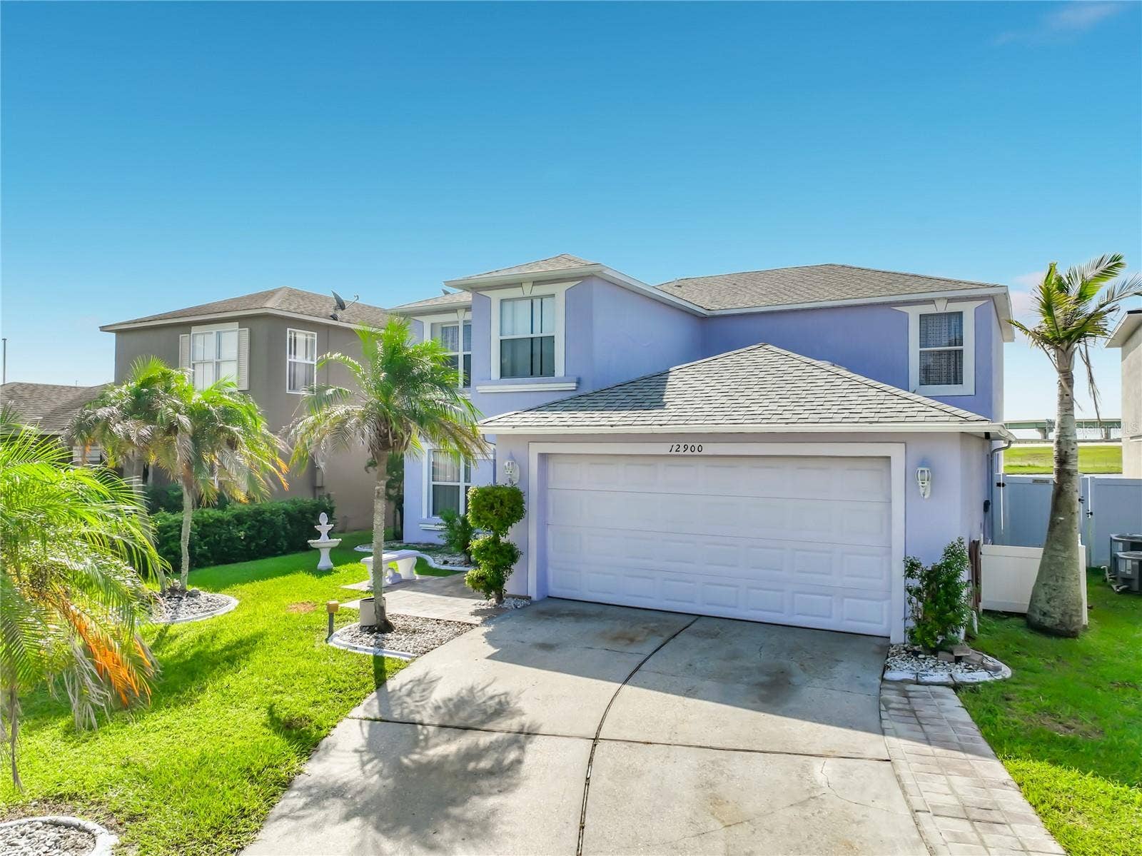 12900 LOS ALAMITOS COURT, Orlando, FL 32837 Front of the home. Attached 2 car garage.