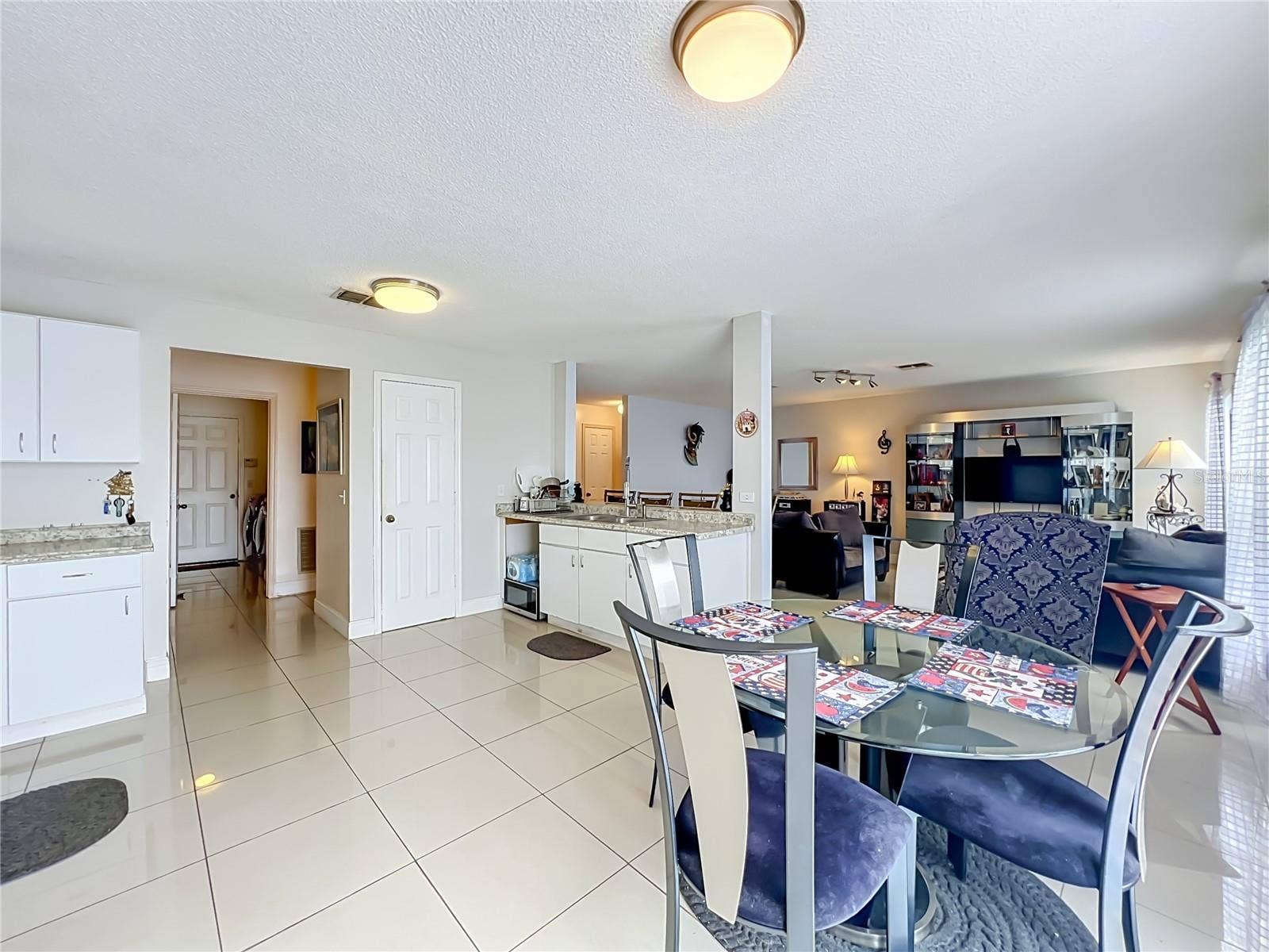 12900 LOS ALAMITOS COURT, Orlando, FL 32837 Dinette area inside large kitchen open to family room