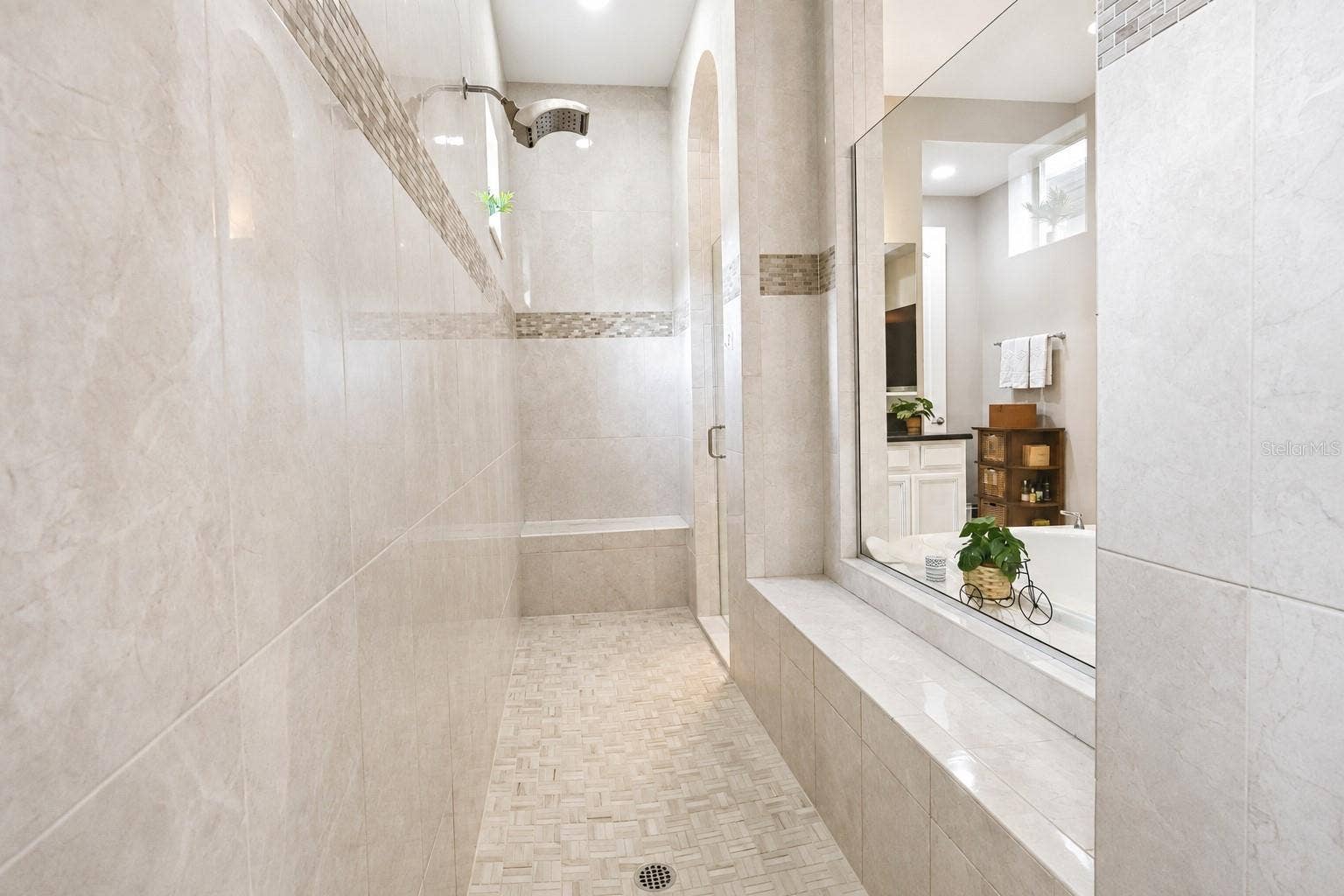 16730 RUSTY ANCHOR ROAD, Winter Garden, FL 34787 Oversized Shower with multiple rain heads, bench, and niche