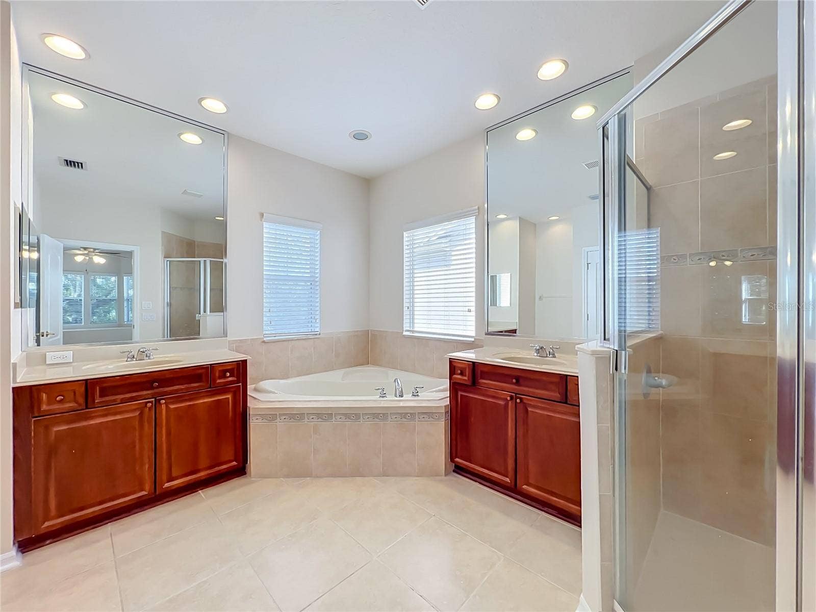 12809 HOLDENBURY LANE, Windermere, FL 34786 Primary bath features 18" ceramic tile floors, garden tub, dual vanities and sinks, separate walk-in shower