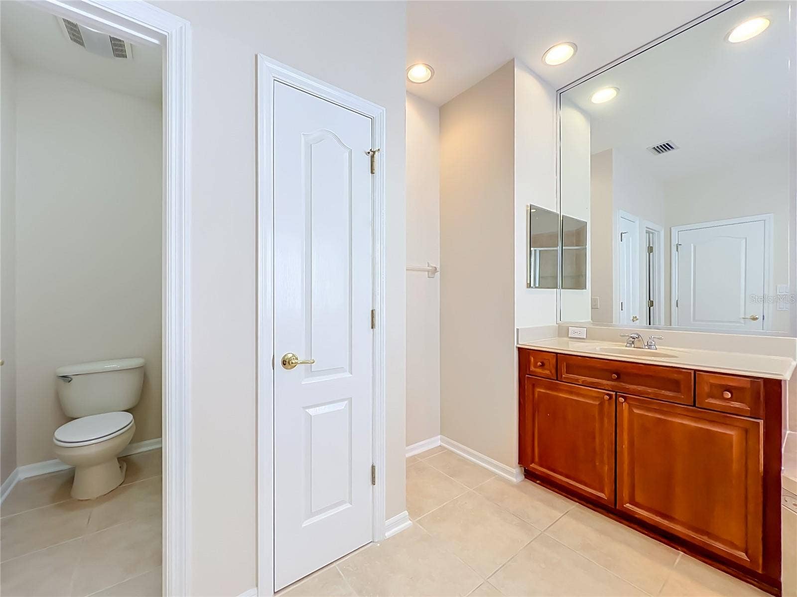 12809 HOLDENBURY LANE, Windermere, FL 34786 Primary bath Linen closet and water closet