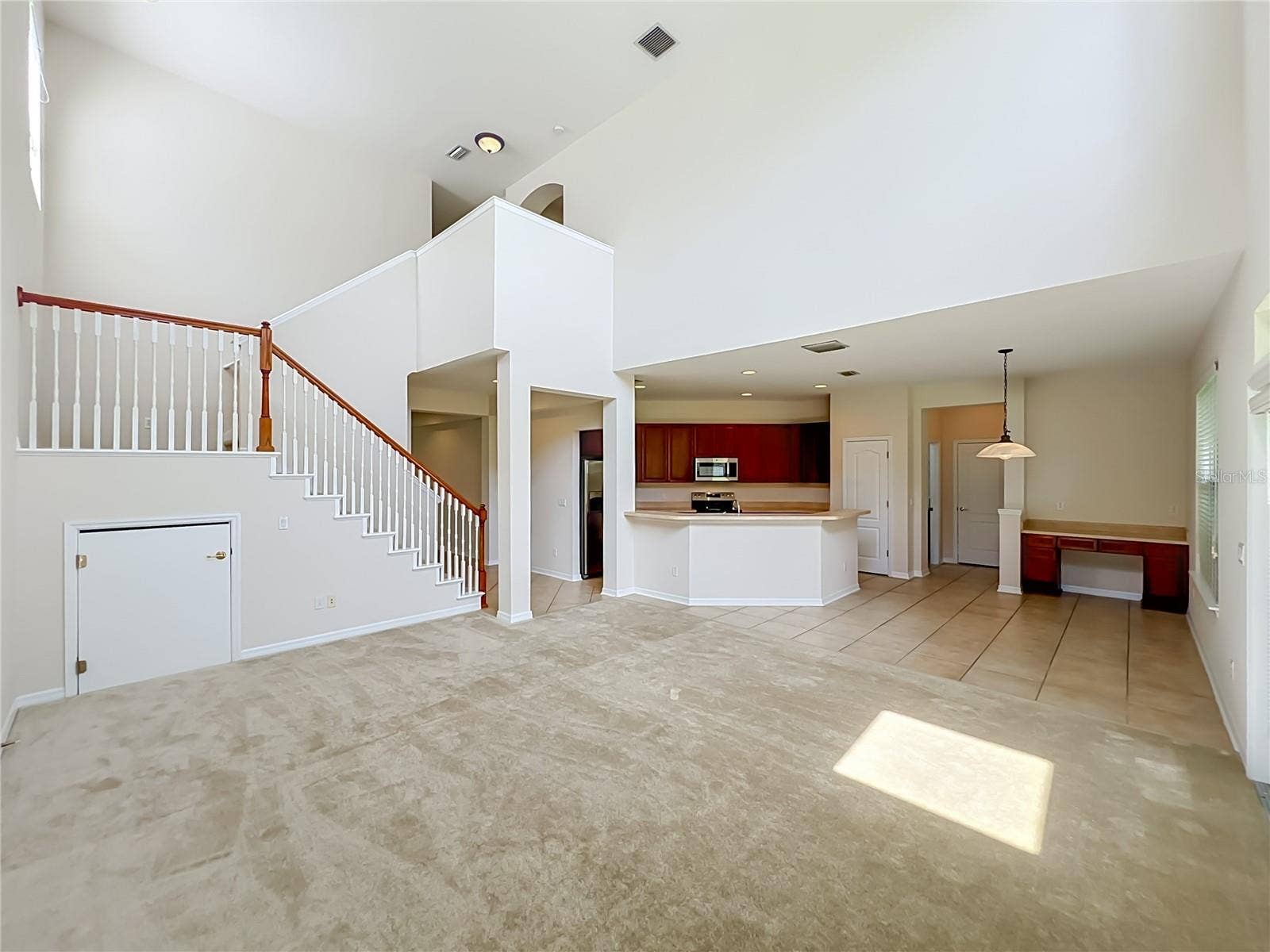 12809 HOLDENBURY LANE, Windermere, FL 34786 Family room/Kitchen/Dinette combination with 2-story ceiling