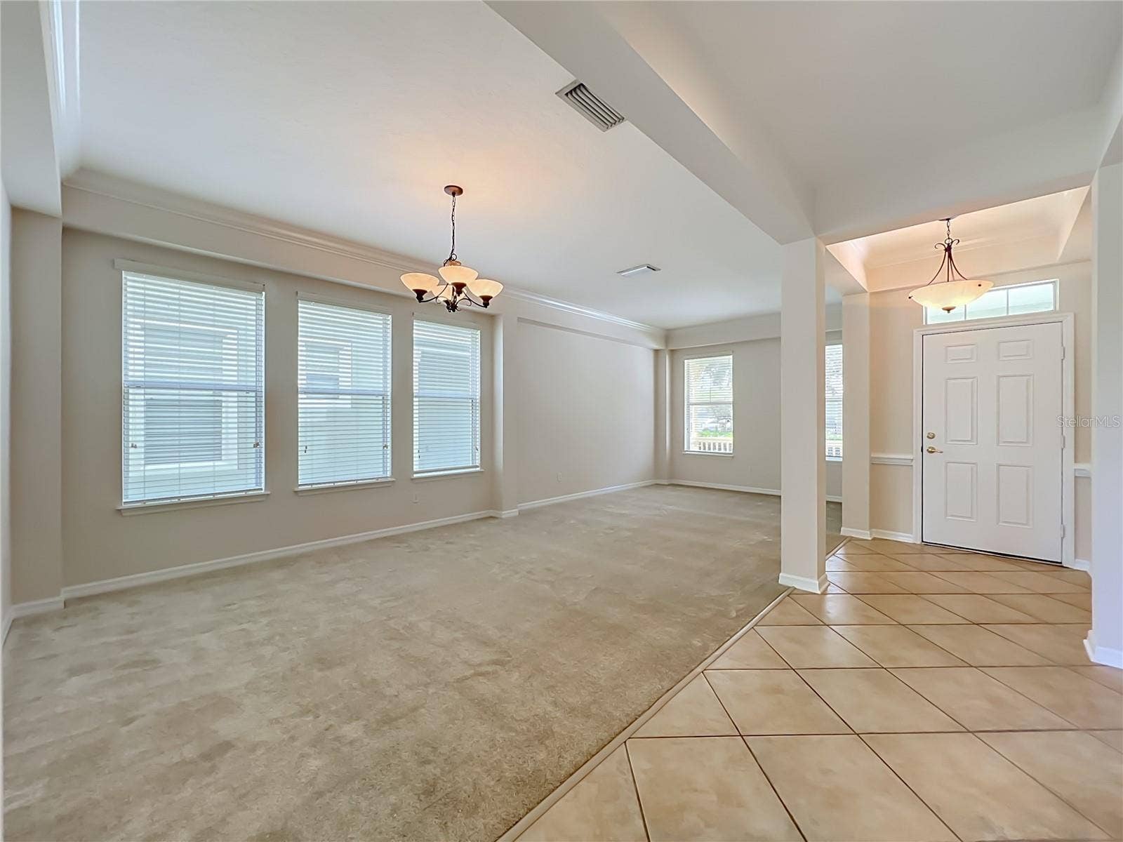 12809 HOLDENBURY LANE, Windermere, FL 34786 Living room/Dining room combination with high ceilings, crown moldings, Ceramic tile at the front door entryway