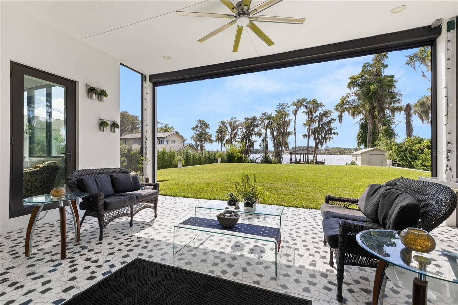 Outdoor patio with mechanical shutters
