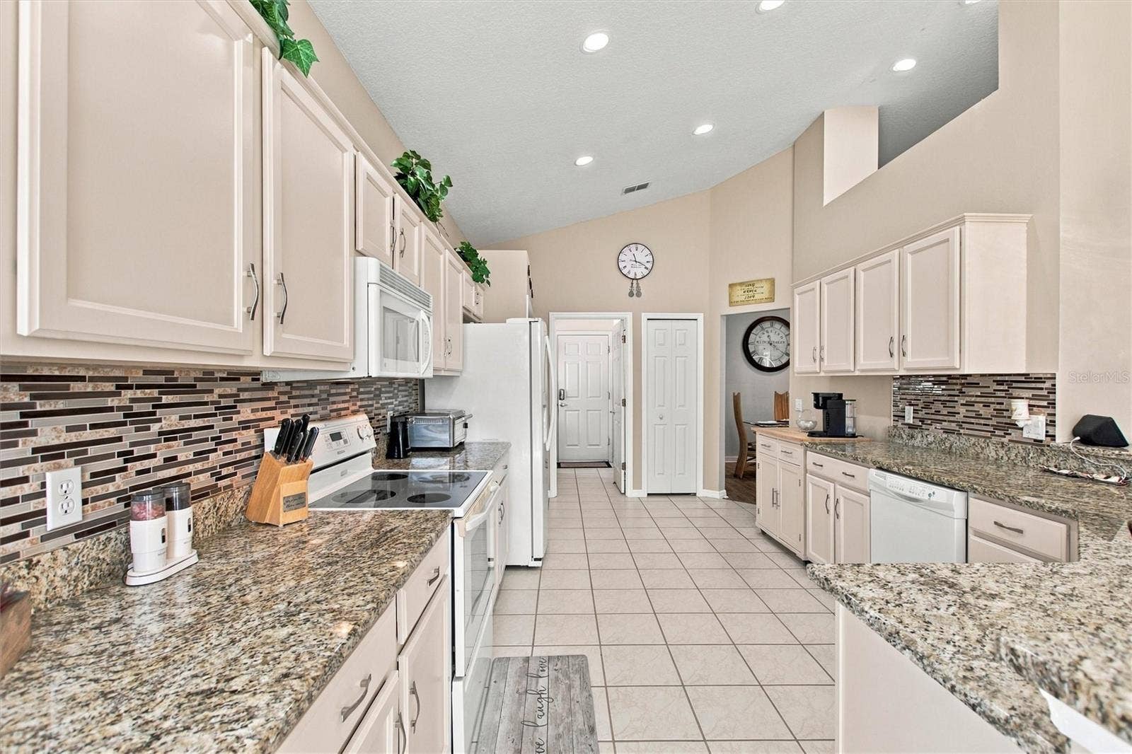217 FLEMING LN, Davenport, FL 33837 Granite countertops, tile backsplash and recessed LED lights