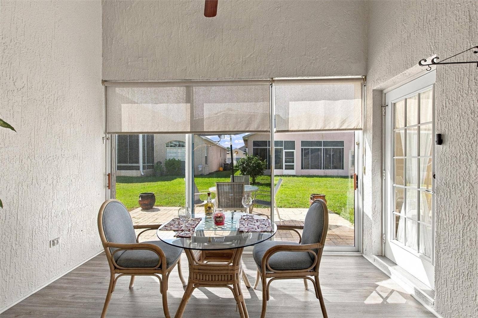 217 FLEMING LN, Davenport, FL 33837 Florida room opens to a brick paver open-air patio
