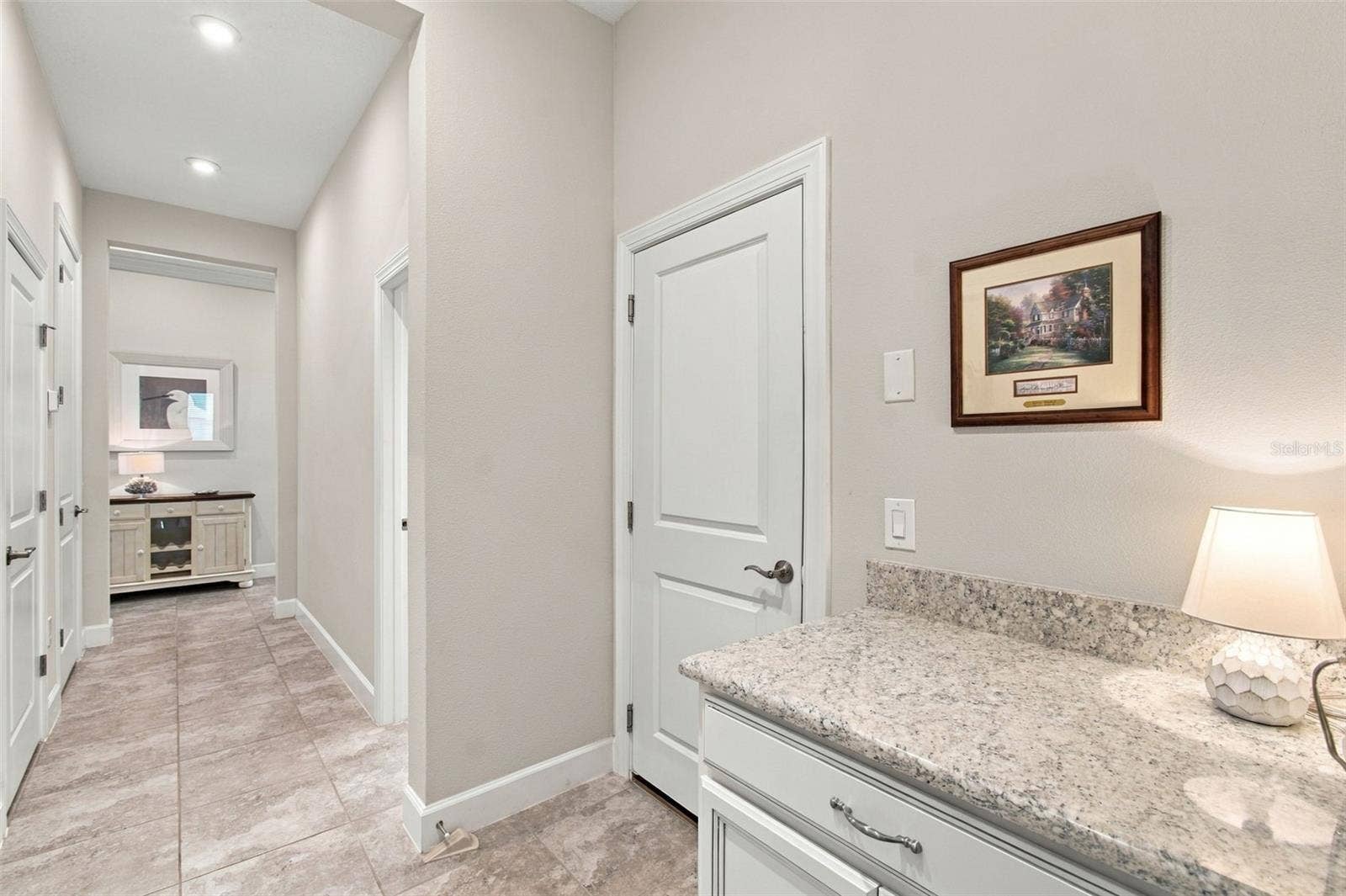 4085 VIA TOLEDO COURT, Poinciana, FL 34759 Hall from Garage with Drop station cabinet