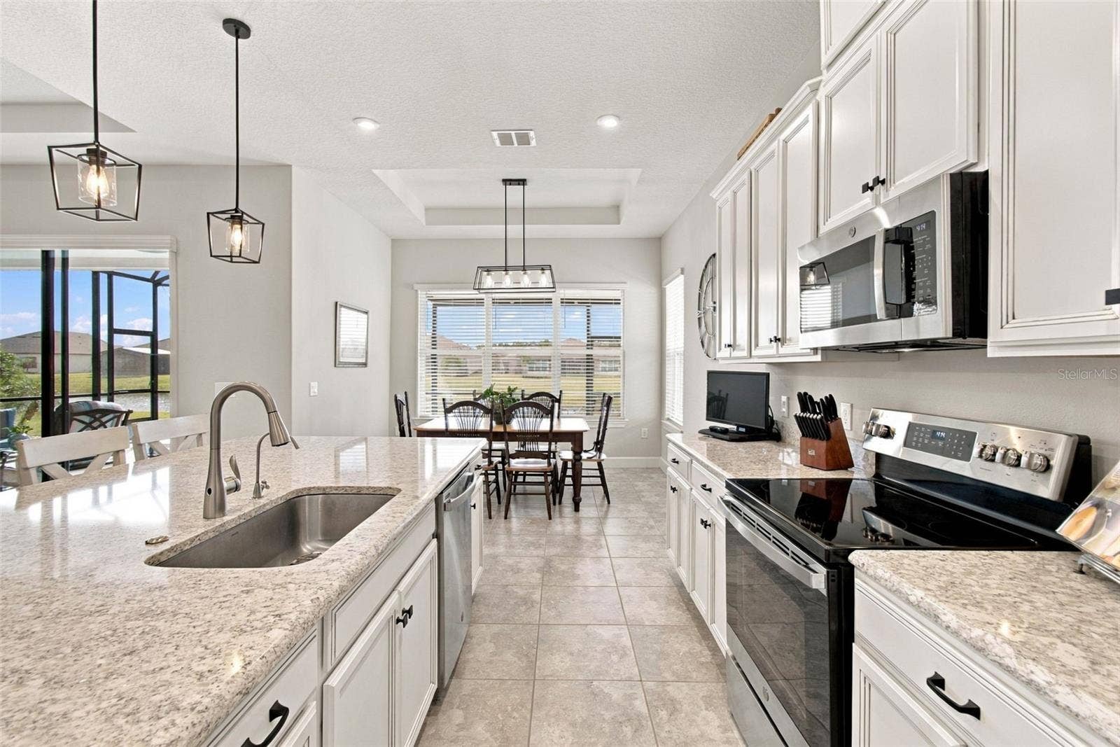 4085 VIA TOLEDO COURT, Poinciana, FL 34759 POND View from Kitchen