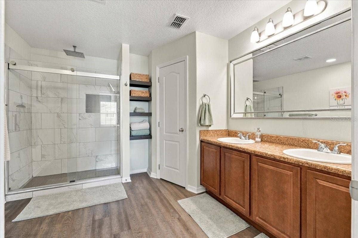 Master bathroom with shower & dual vanity