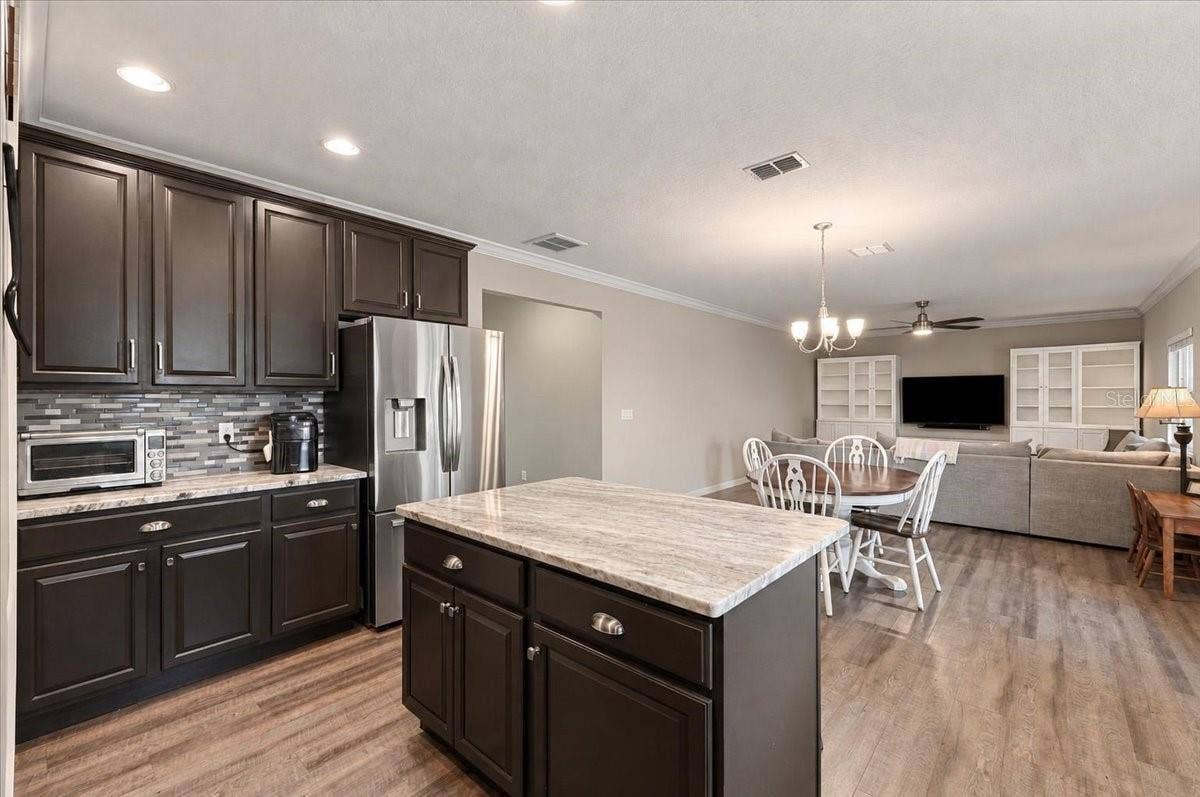 Overview of kitchen, nook and family room combo