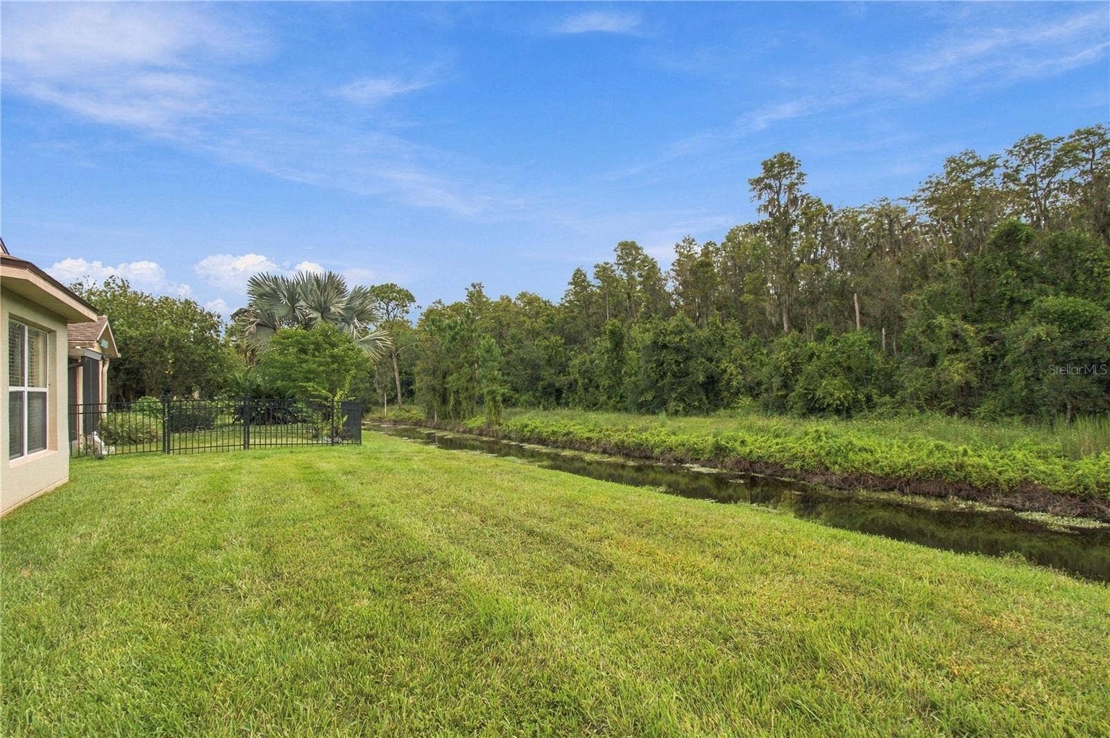 516 GRAND CANAL DR, Poinciana, FL 34759 CANAL AND CONSERVATION VIEWS!!