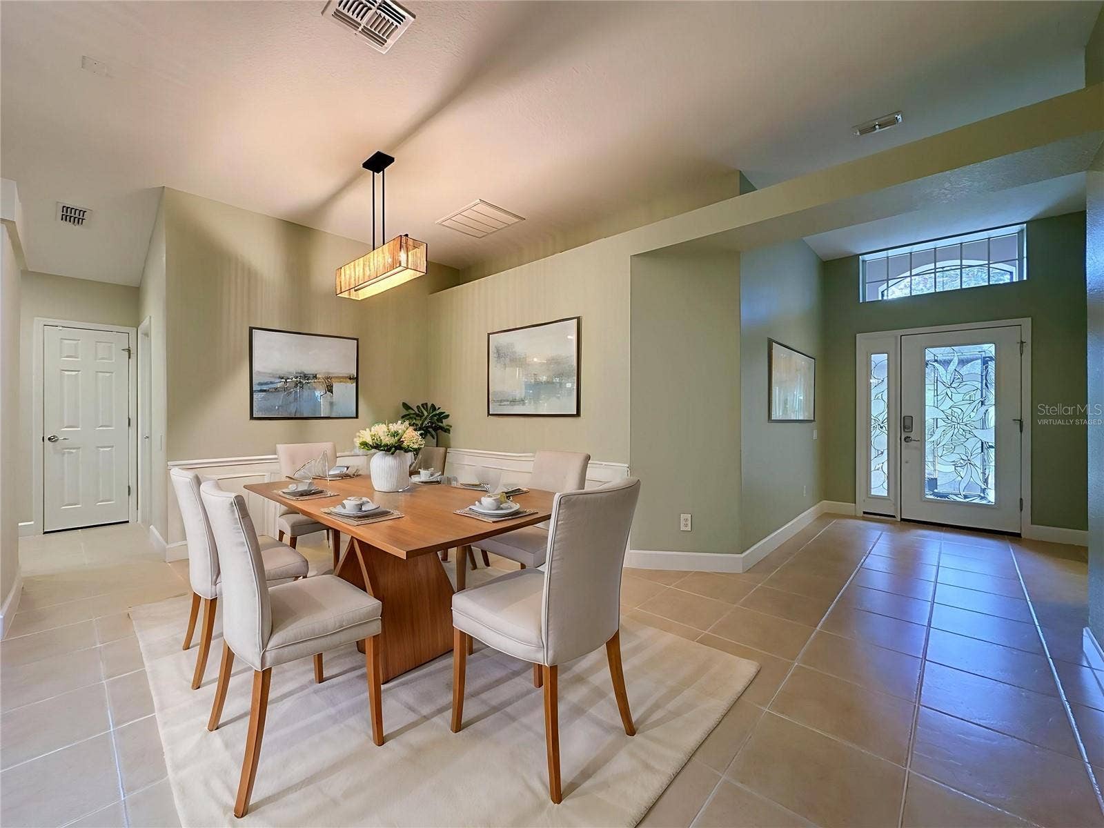 516 PLAYA DR, Davenport, FL 33837 Virtually Staged dining area