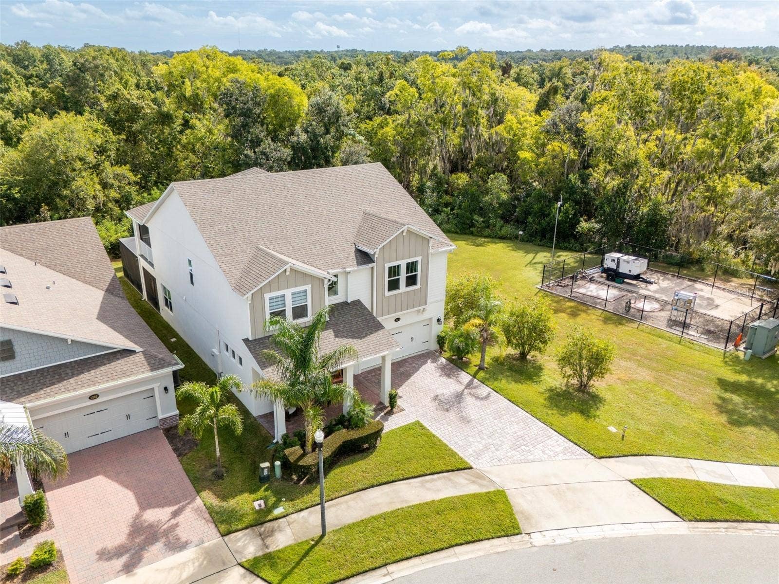 1316 SOUTHERN SUN DRIVE, Oakland, FL 34787 Aerial view showcasing conservation surroundings with no rear neighbors or neighboring home on the right.