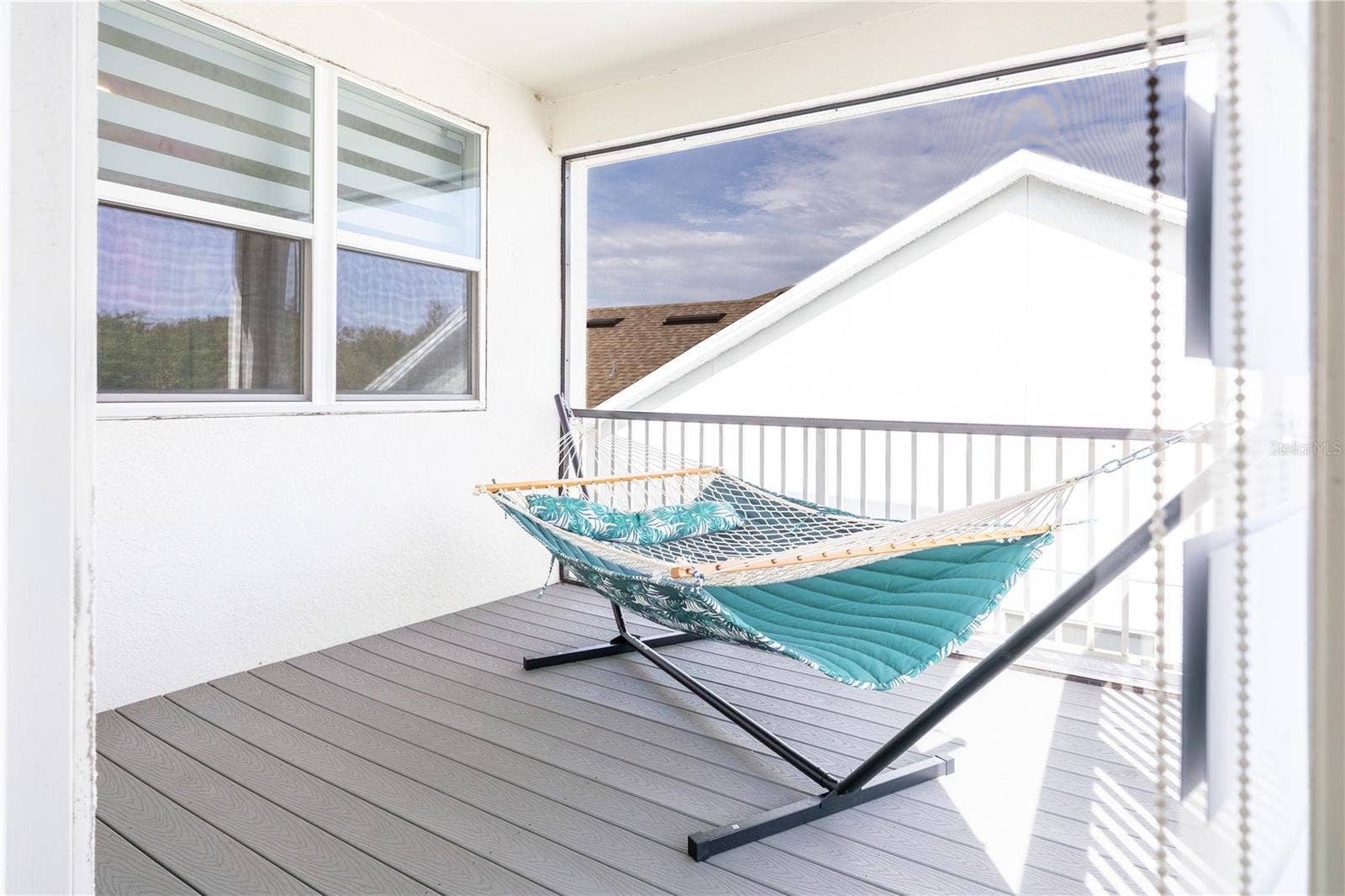 1316 SOUTHERN SUN DRIVE, Oakland, FL 34787 Covered upstairs balcony overlooking a conservation area, ideal for relaxing.