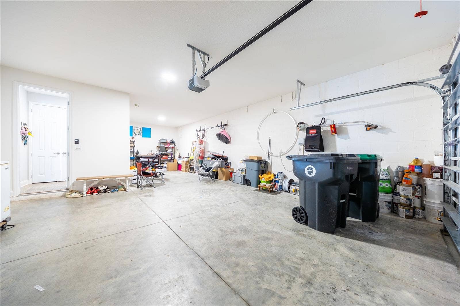 1316 SOUTHERN SUN DRIVE, Oakland, FL 34787 Spacious garage with direct home access and additional room for storage or a workshop.