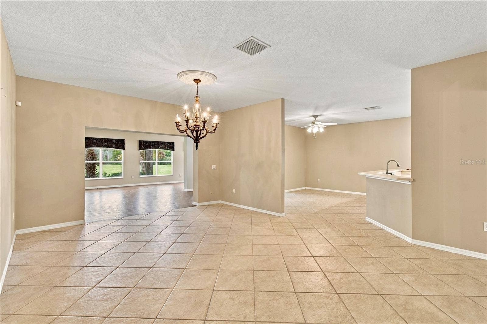 352 HAMRICK DR, Poinciana, FL 34759 Living room W/ Tile on the Diagonal