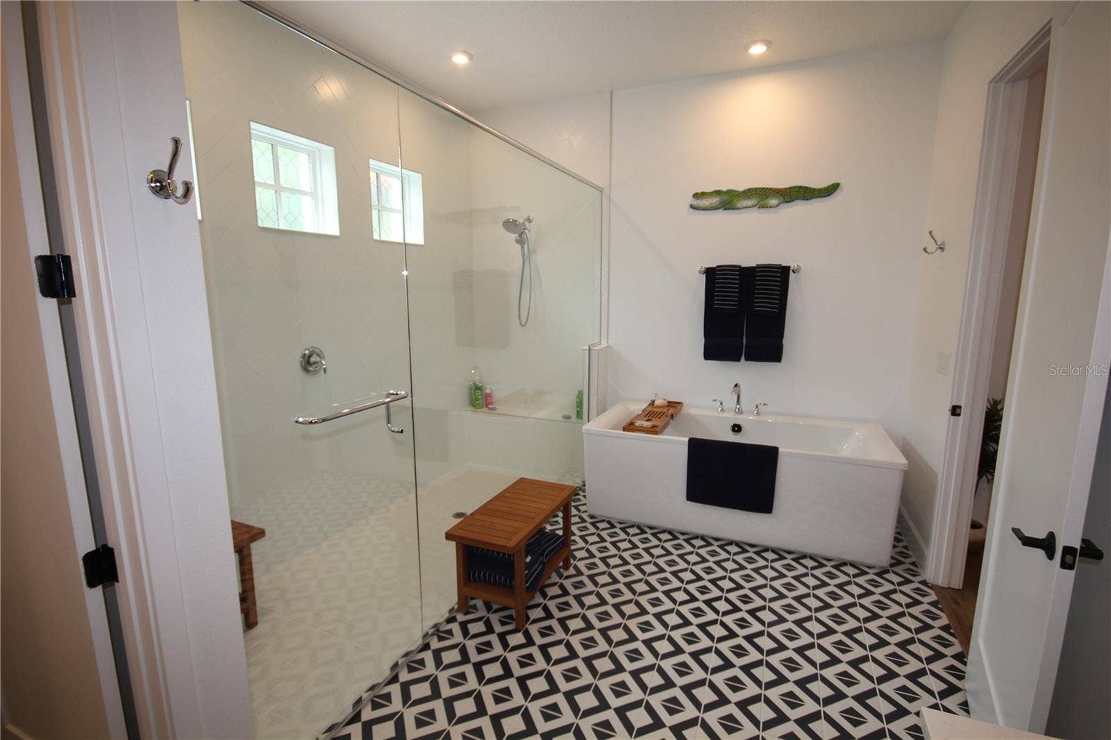 1859 BEACH RIDGE RD, Celebration, FL 34747 WALK-IN SHOWER WITH BUILT-IN BENCH AND FREESTANDING SOAKING TUB