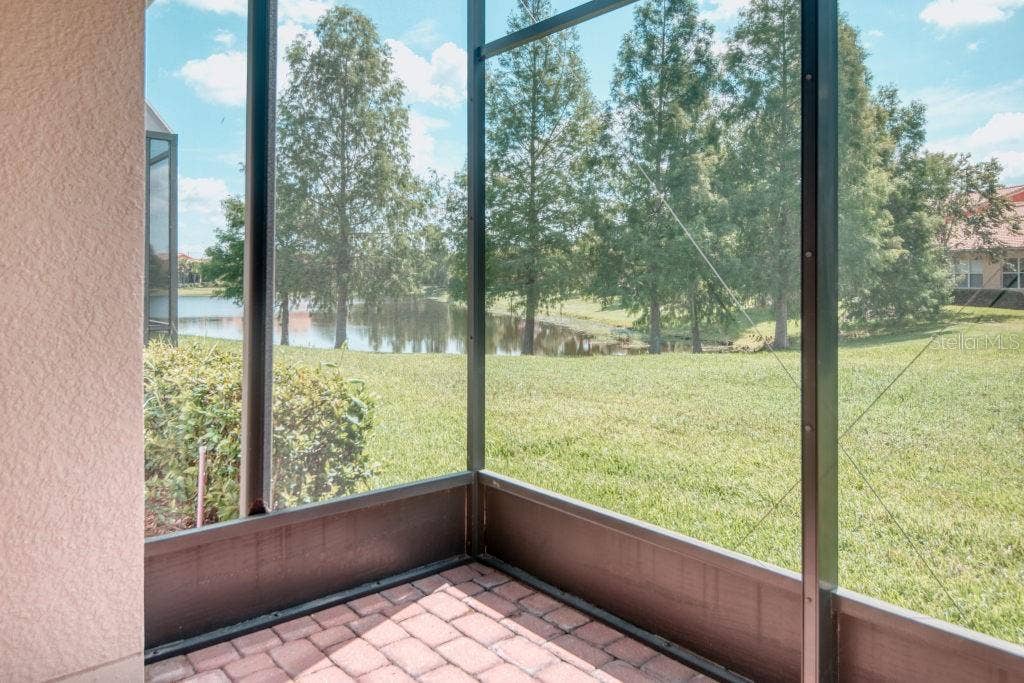 3432 FALLBROOK DRIVE, Poinciana, FL 34759 POND View from Screen Lanai