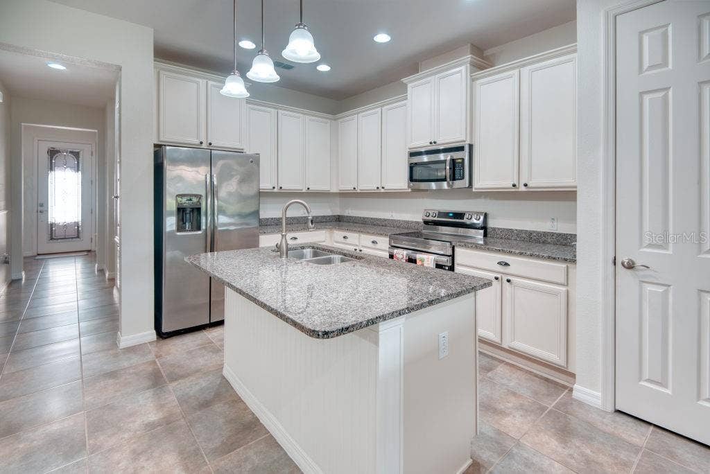 3432 FALLBROOK DRIVE, Poinciana, FL 34759 Foyer & Kitchen View