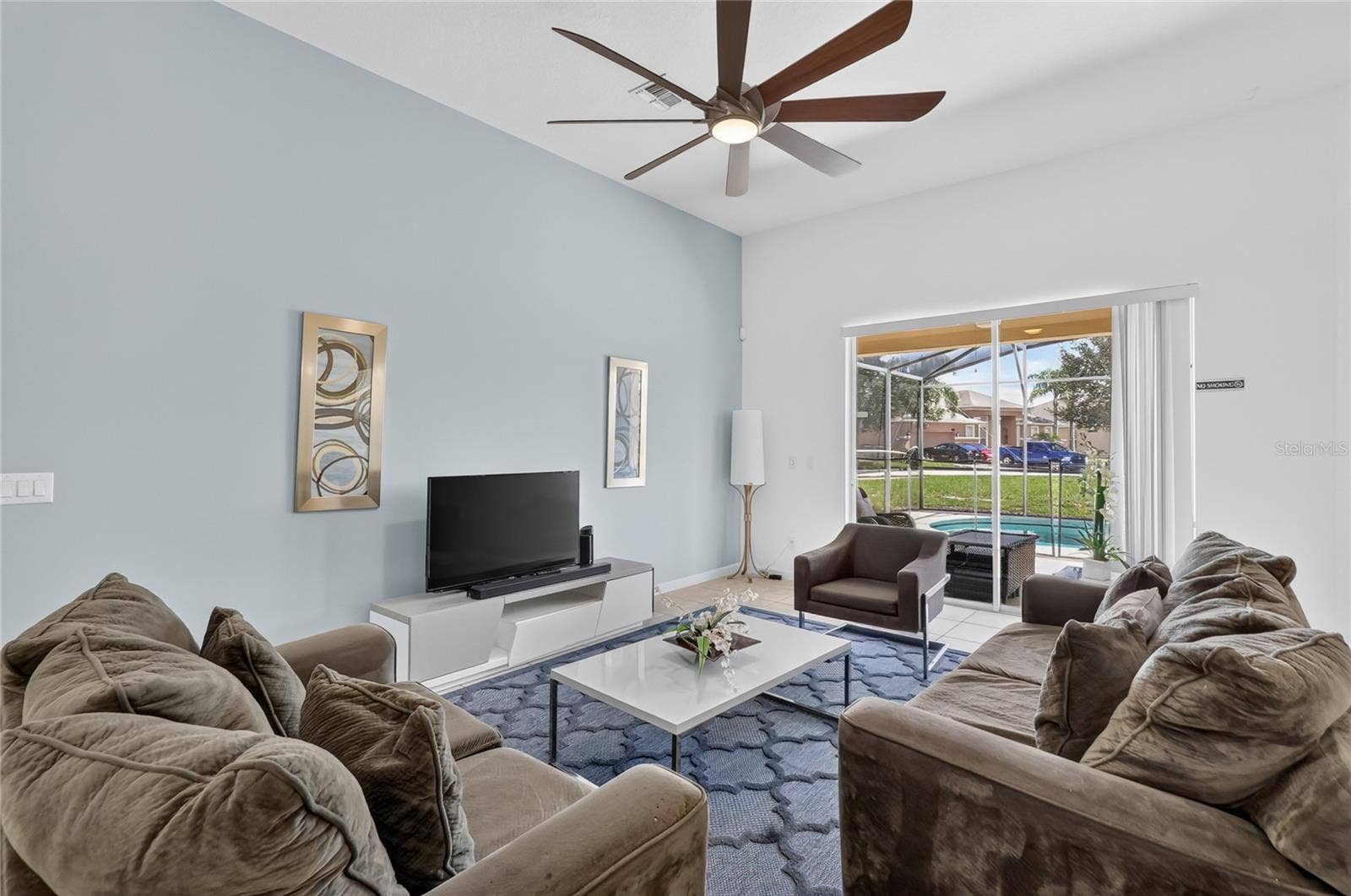 277 YELLOW SNAPDRAGON DRIVE, Davenport, FL 33837 Family room with view of the pool