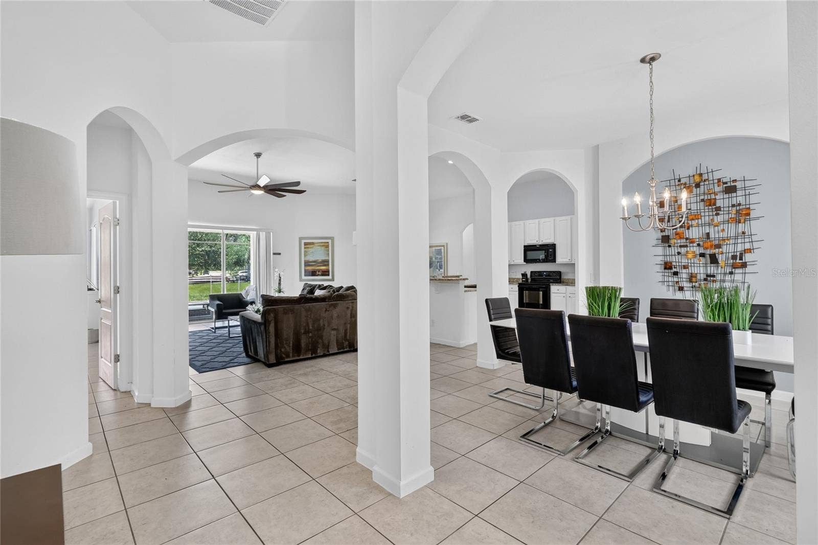 277 YELLOW SNAPDRAGON DRIVE, Davenport, FL 33837 Dining room to the right with family room straight ahead