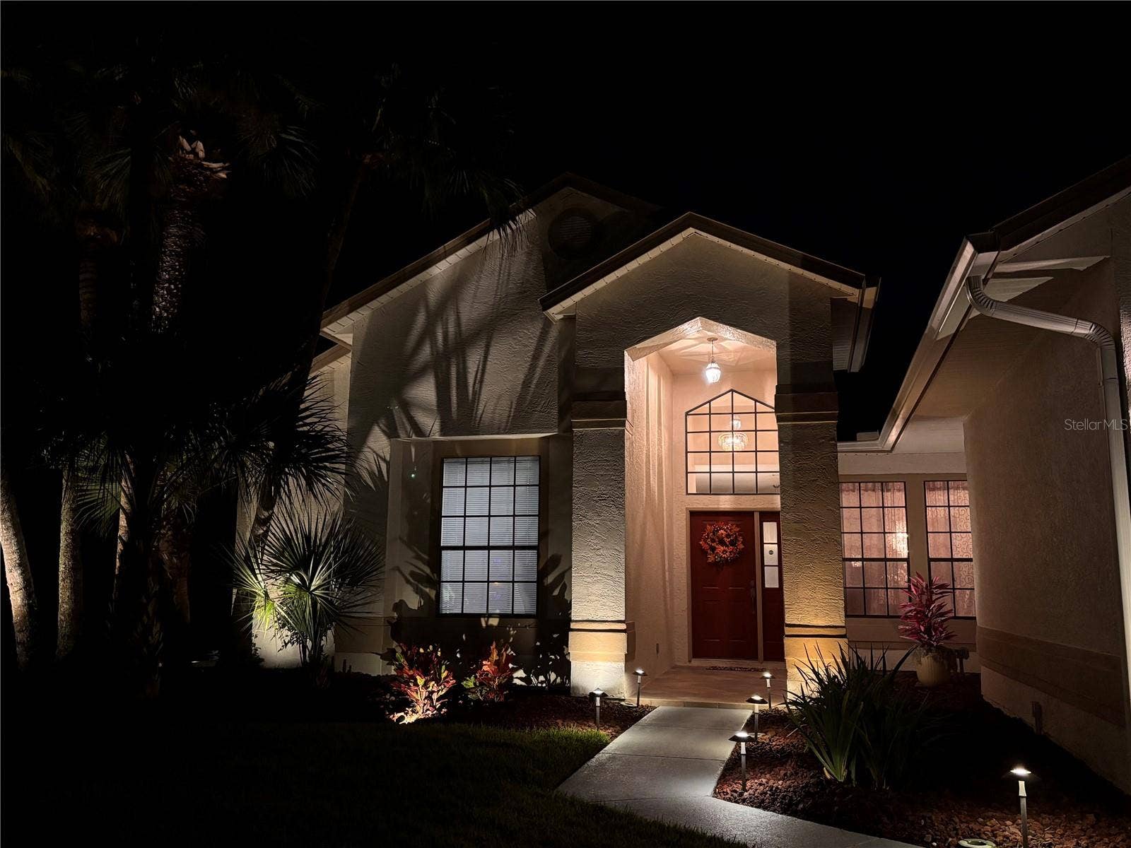3514 OCITA DRIVE, Orlando, FL 32837 Evening view of the front entrance