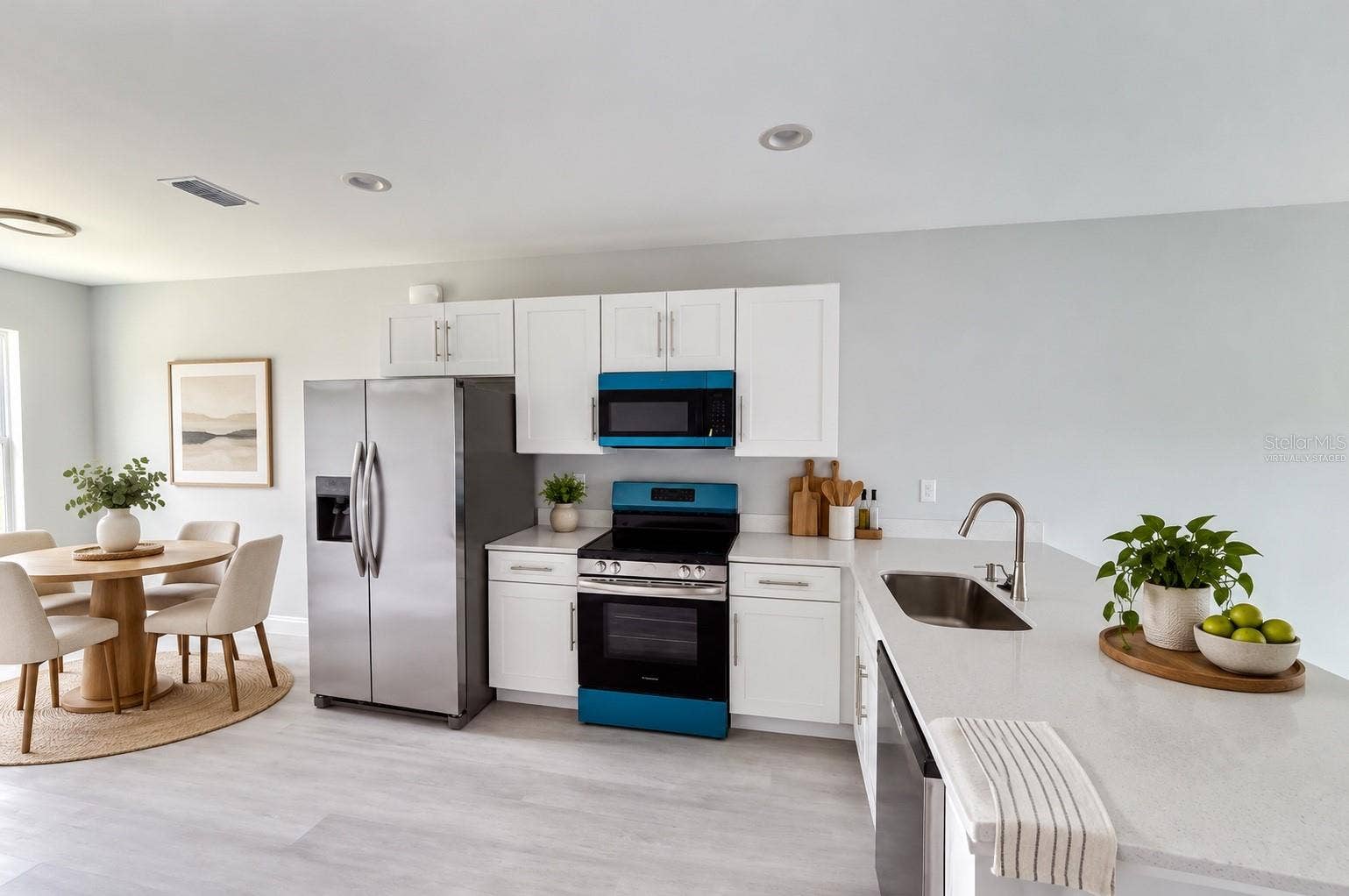 11779 WILLMINGTON BOULEVARD, #11779, Port Charlotte, FL 33981 Virtually staged - kitchen and dining area.
