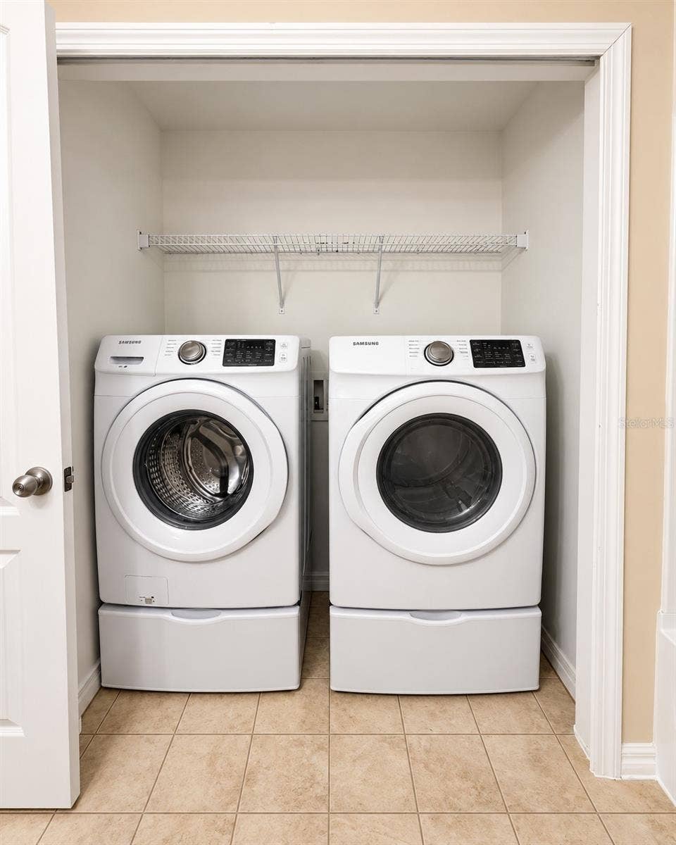 5481 LIMESTONE LANE, Lakeland, FL 33809 laundry room inside hall bathroom upstairs