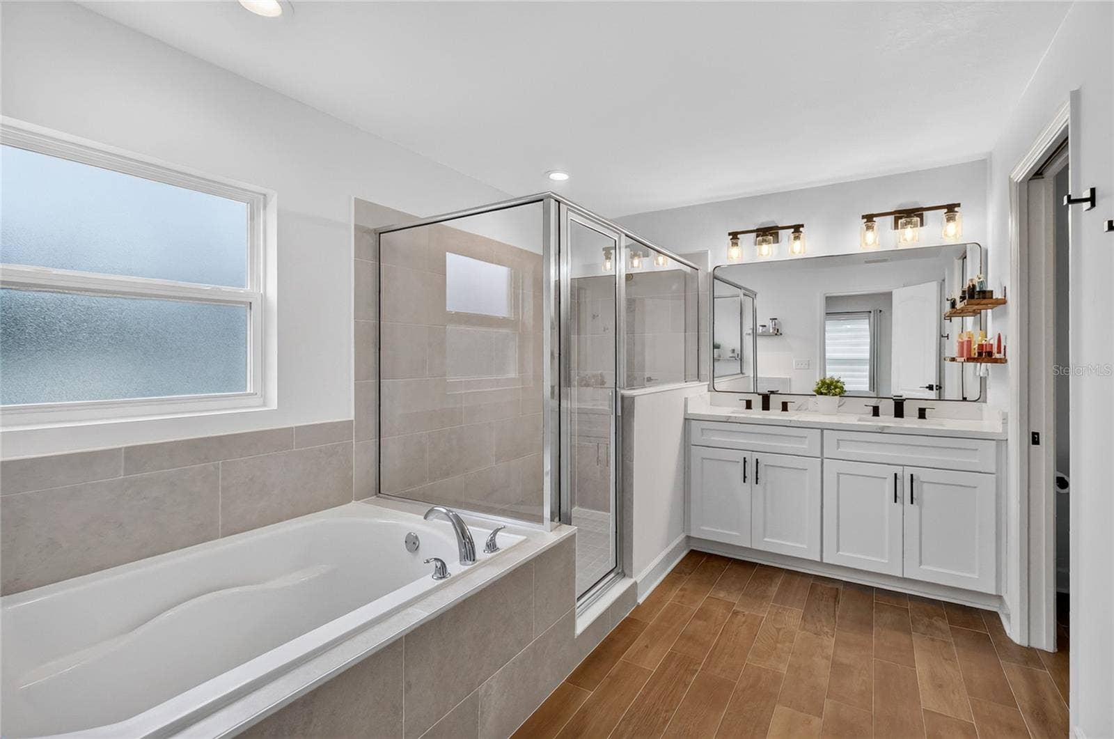 Ensuite bath has walk-in shower and tub which is hard to find these days in new construction