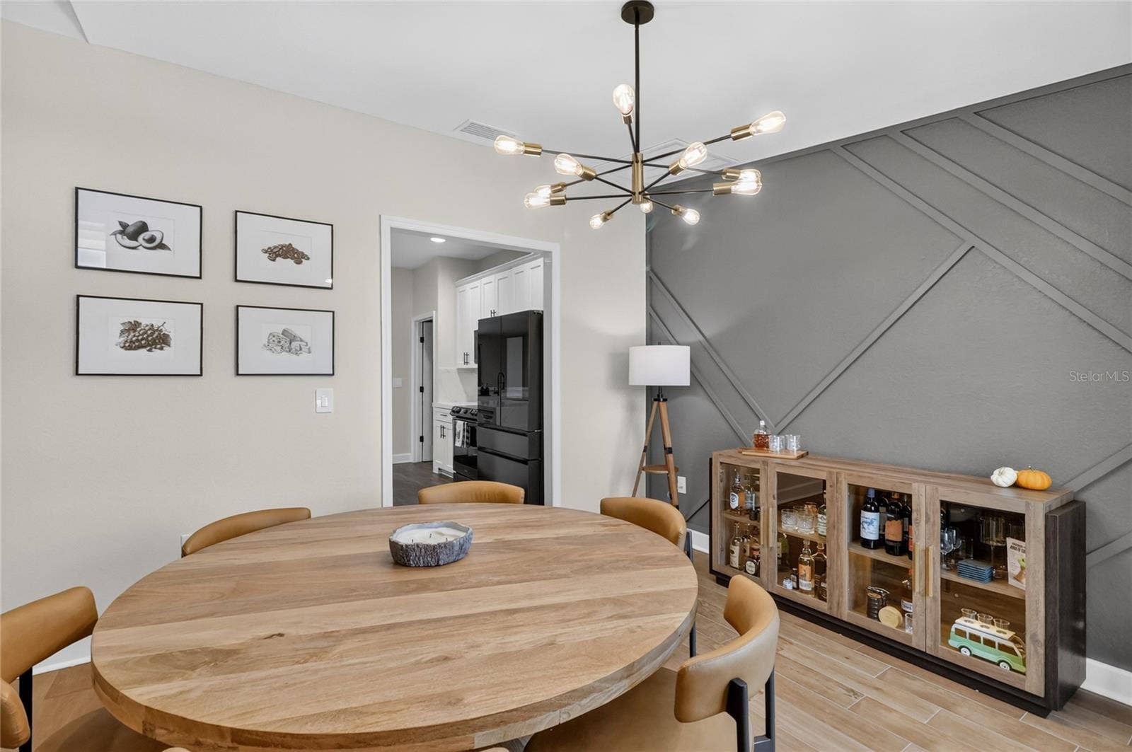 Plenty of room for a larger dining room table. Look at that upgraded light fixture
