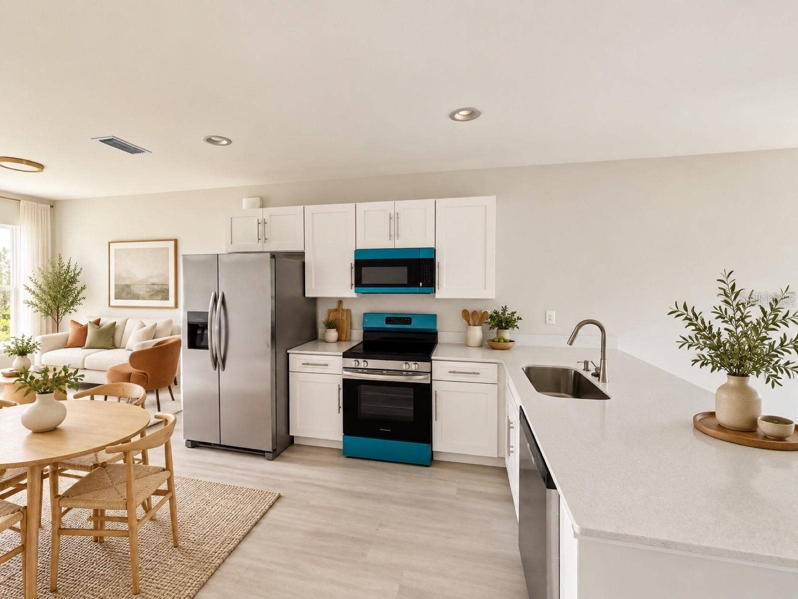 612 BLUEBILL COURT, Poinciana, FL 34759 Virtually staged kitchen and dining area; furniture and decor are digitally added.