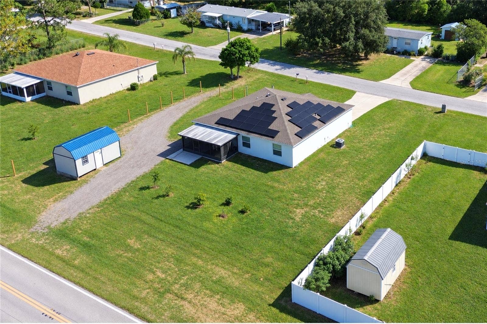14 ROELS STREET, Haines City, FL 33844 Aerial view of the property and its surroundings from another angle.
