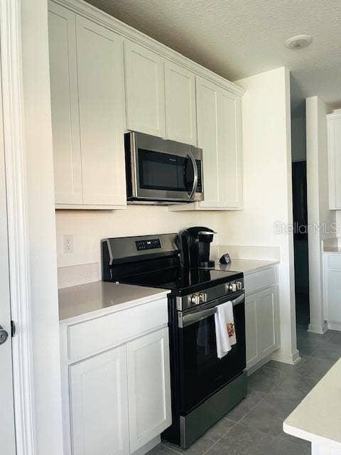 Beautiful White kitchen Cabinets & front-control Electric Range