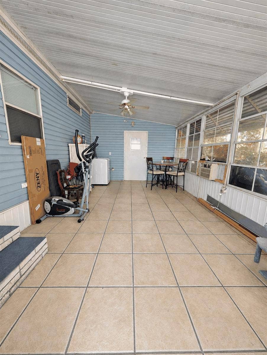 6066 SE SOUTHERN OAKS DRIVE, Winter Haven, FL 33884 Side screened porch