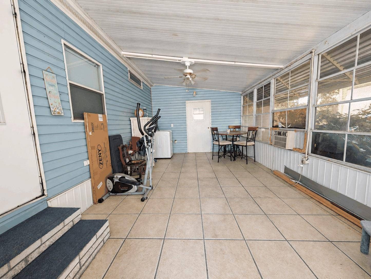 6066 SE SOUTHERN OAKS DRIVE, Winter Haven, FL 33884 Side Screened Porch behind the Carport
