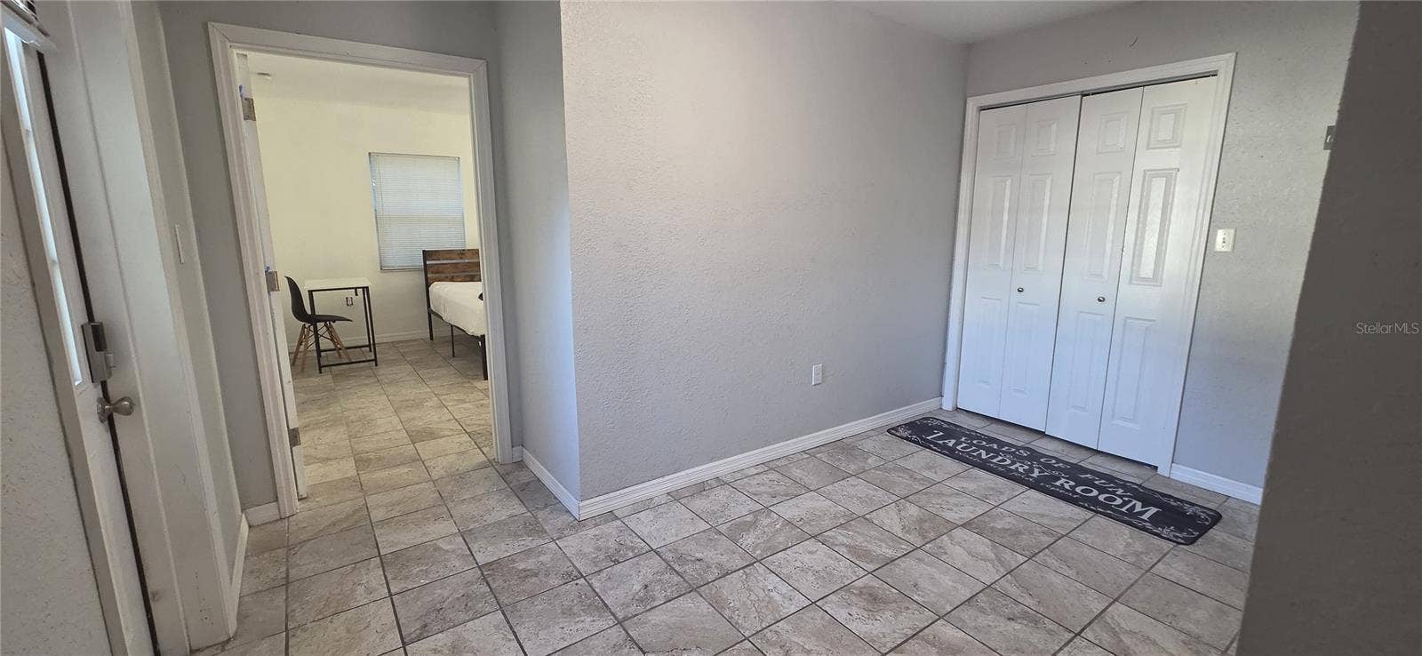 703 AVENUE L SE, Winter Haven, FL 33880 Laundry/Master bedroom entrance