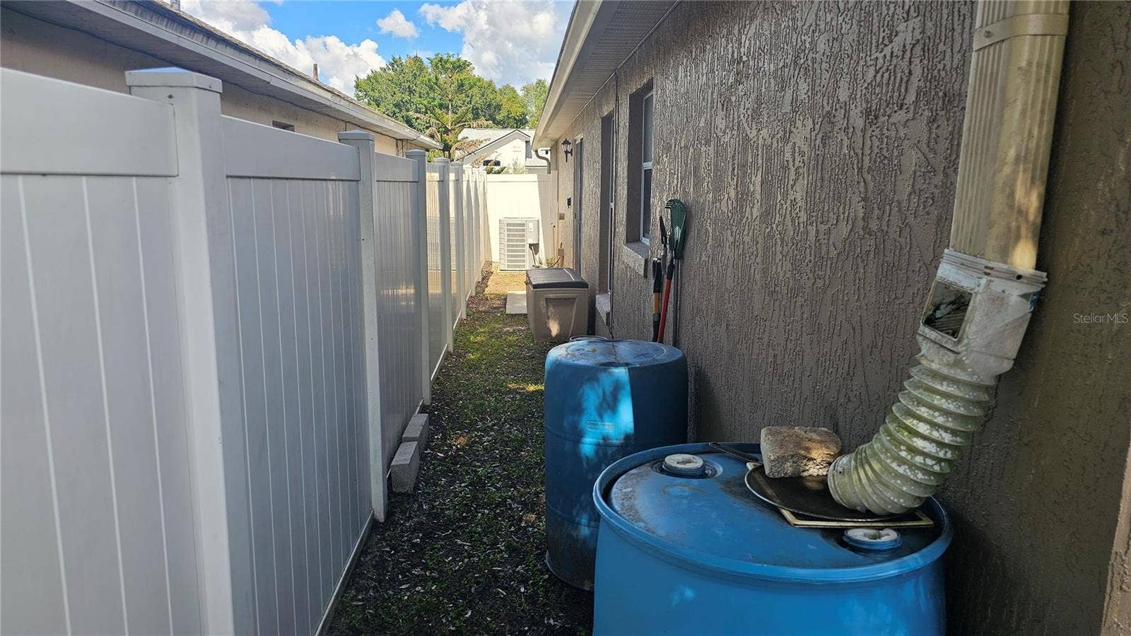 8632 FOLEY DRIVE, Orlando, FL 32825 Side Exterior & Vinyl Fencing