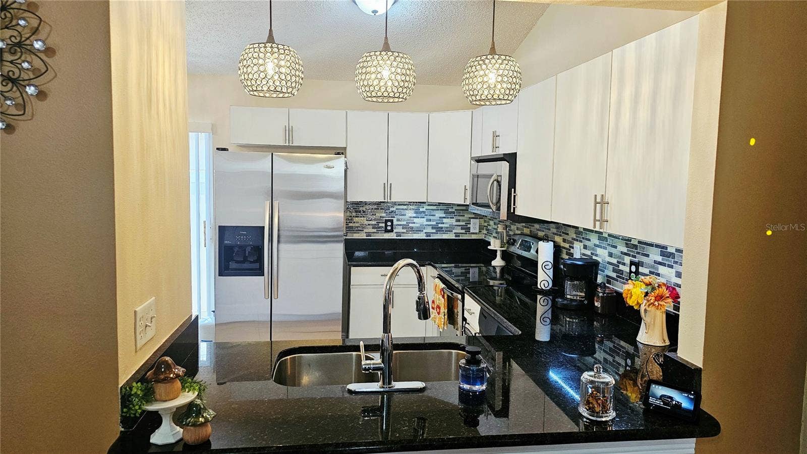 8632 FOLEY DRIVE, Orlando, FL 32825 Kitchen Pass-Through View