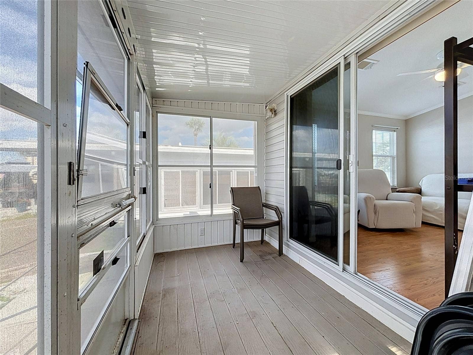 9000 US HIGHWAY 192, #181, Clermont, FL 34714 Screened in porch with vinyl windows provides wonderful views of the canal