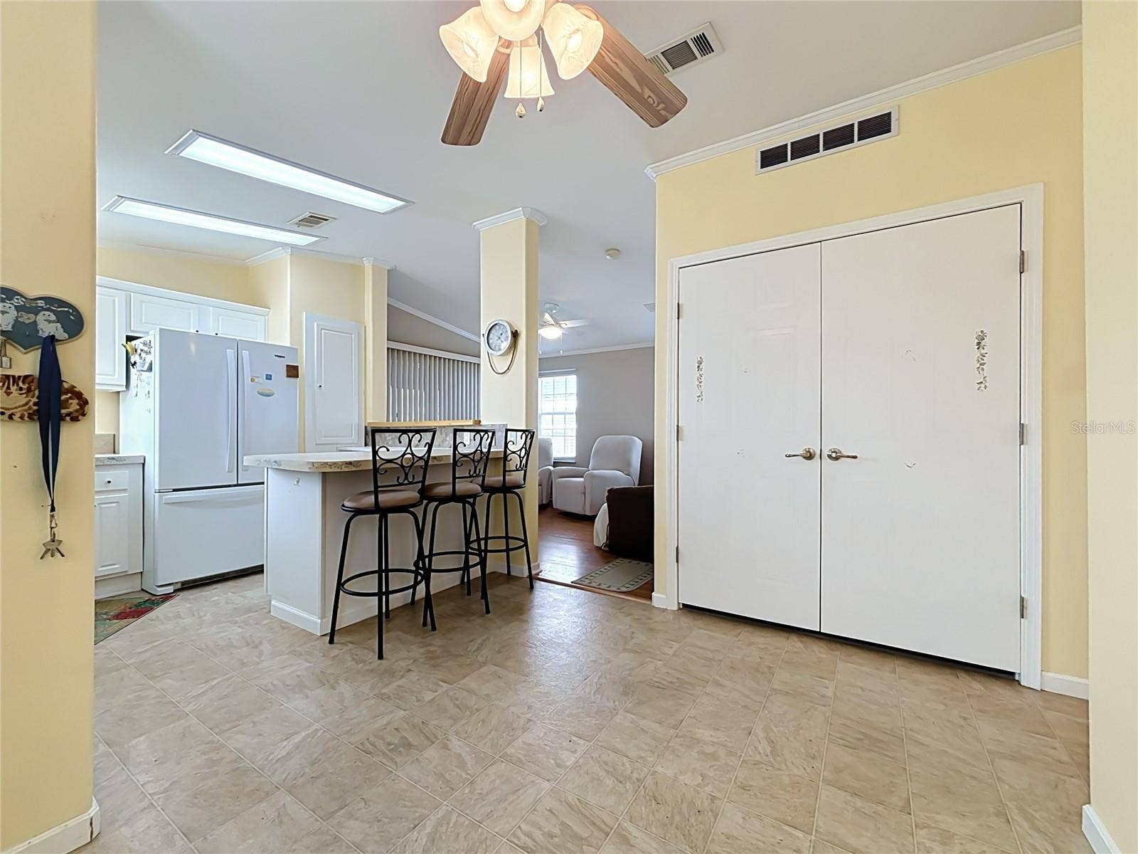 9000 US HIGHWAY 192, #181, Clermont, FL 34714 Behind those double doors is a stackable washer/dryer and storage space