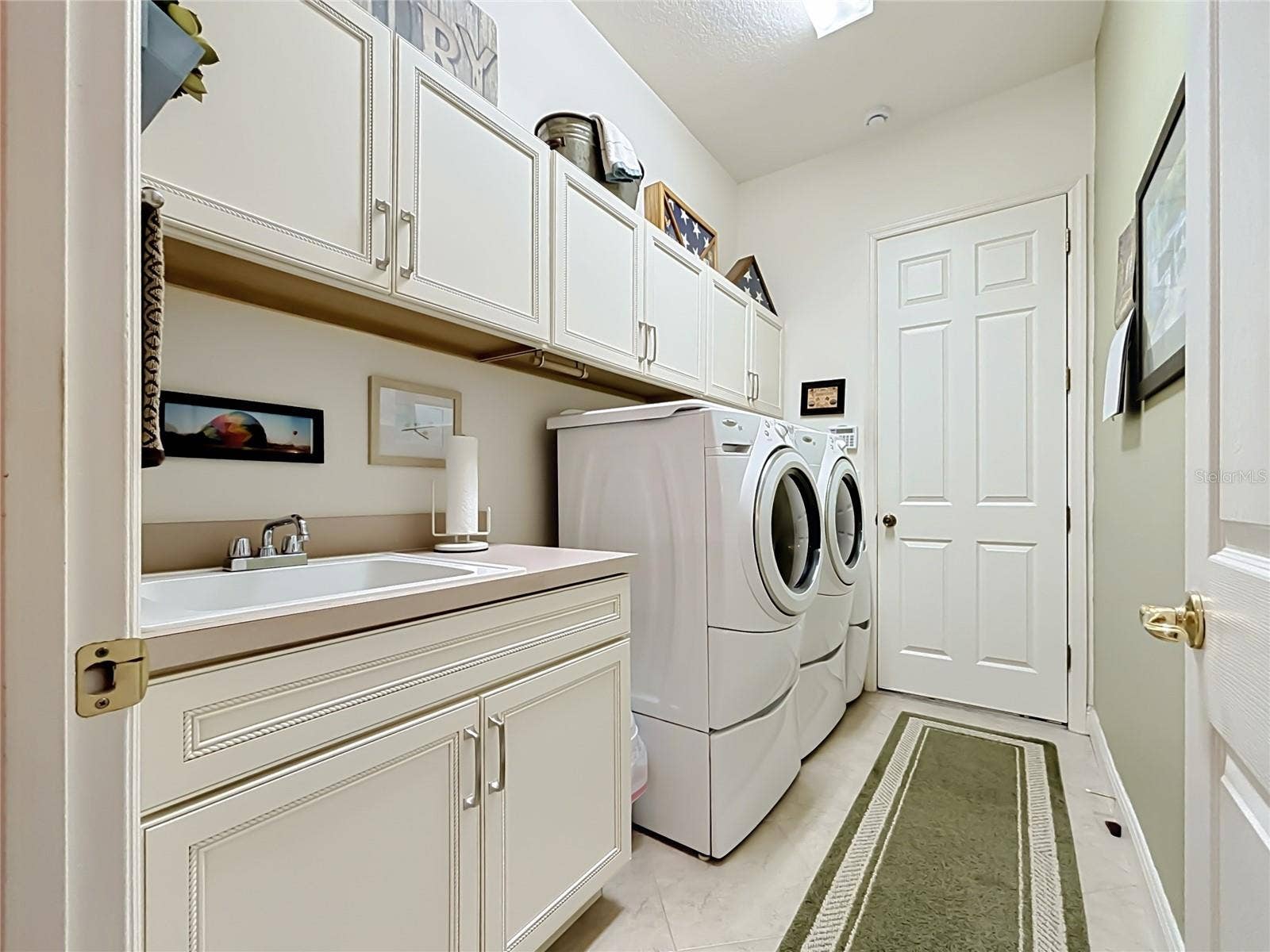 265 INDIAN WELLS AVENUE, Poinciana, FL 34759 Laundry Room w/ Sink & Cabinets