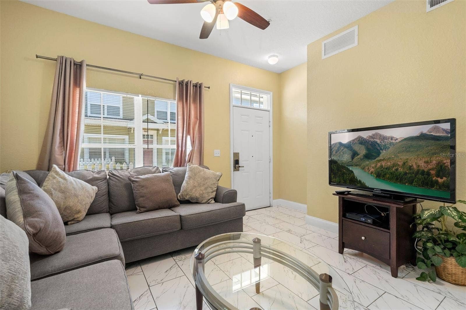 4600 YELLOWGOLD ROAD W, #105, Kissimmee, FL 34746 Living Room / Front Door