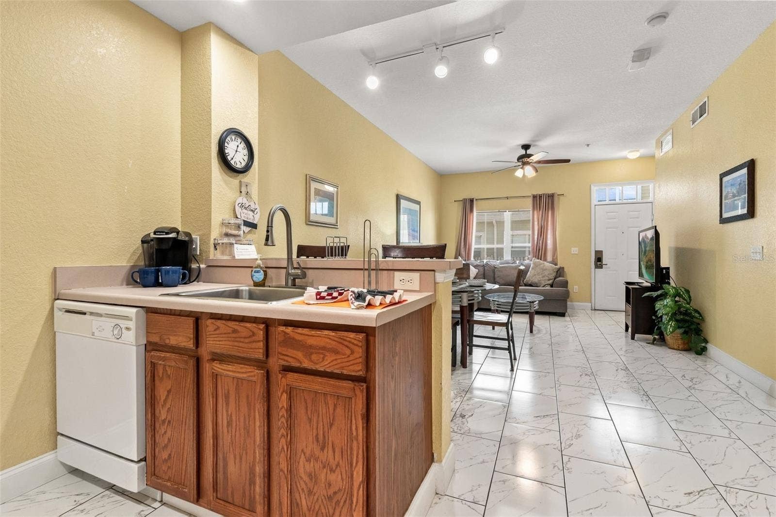 4600 YELLOWGOLD ROAD W, #105, Kissimmee, FL 34746 Kitchen with high-top seating.