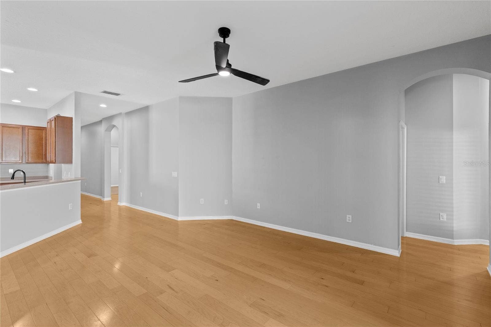 3214 BAYFLOWER AVE, Harmony, FL 34773 Living area off kitchen leading to Guest bedroom