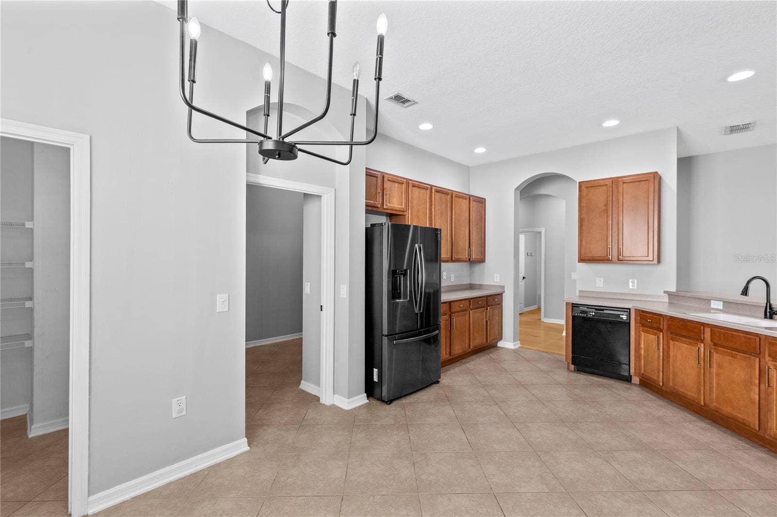 3214 BAYFLOWER AVE, Harmony, FL 34773 Kitchen showing pantry and laundry room