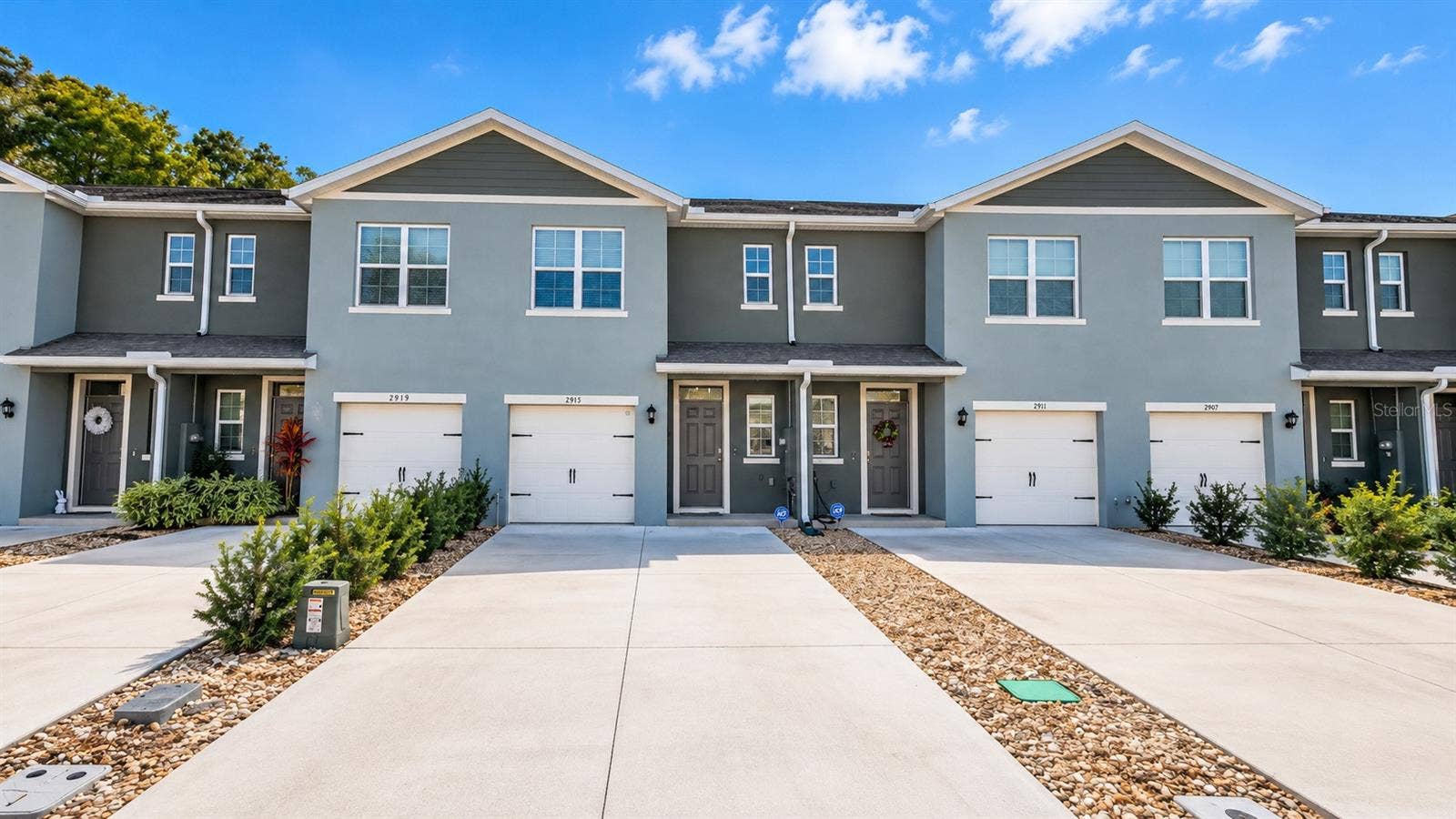 Front exterior and attached garage.